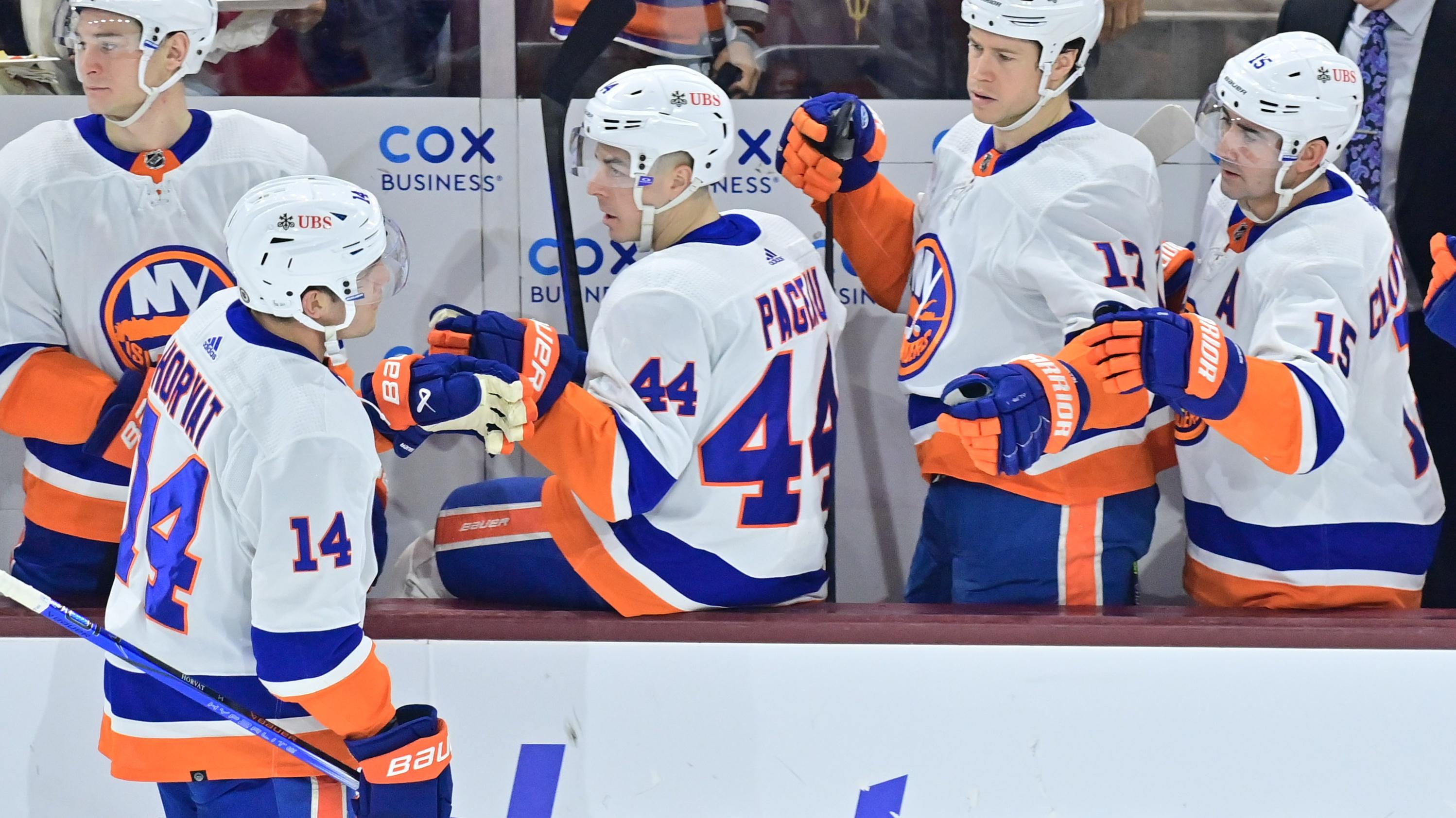 New York Islanders center Bo Horvat (14) celebrates with teammates after scoring a goal in the first period against the Arizona Coyotes at Mullett Arena / Matt Kartozian - USA TODAY Sports