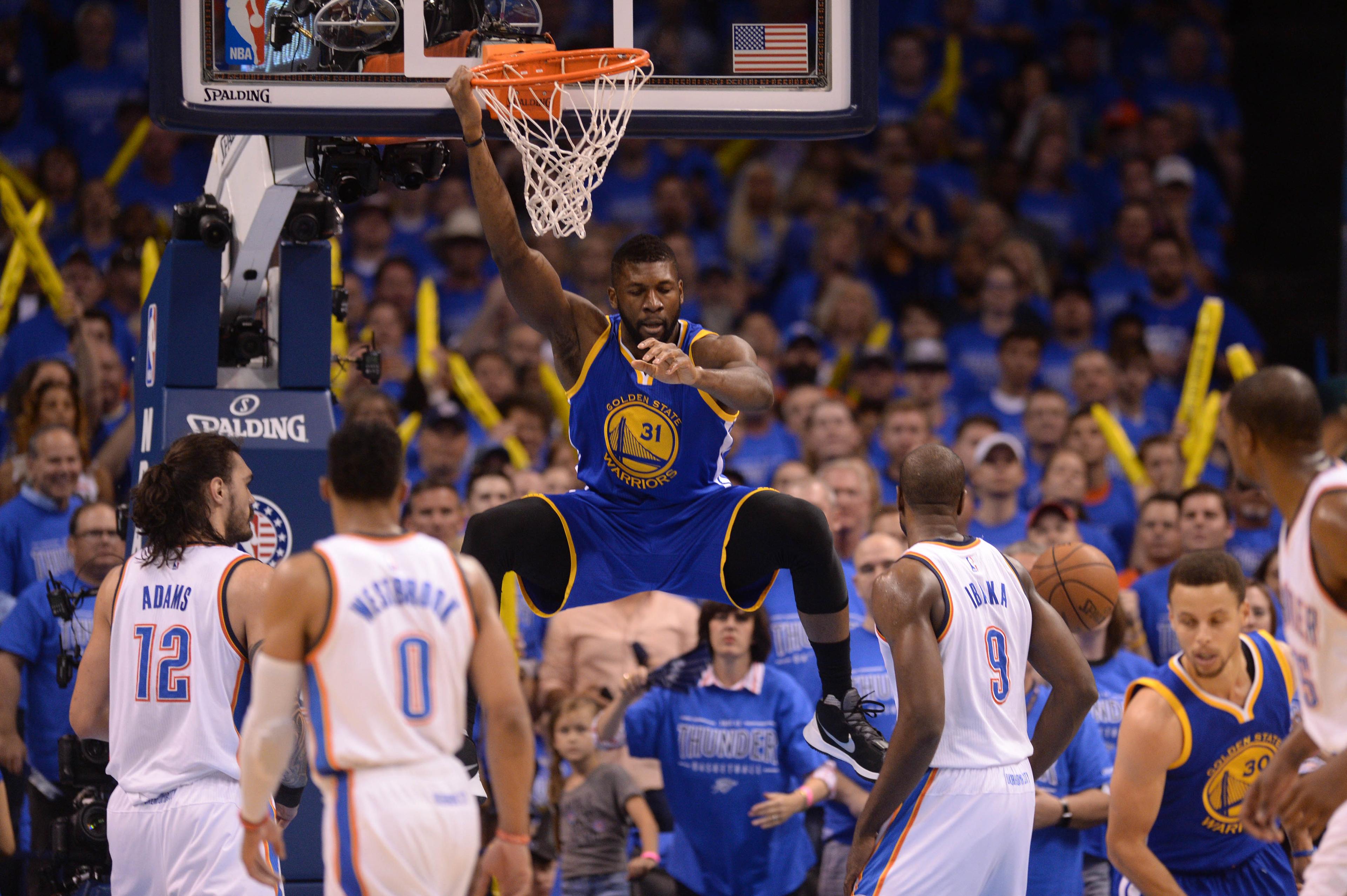 May 28, 2016; Oklahoma City, OK, USA; Golden State Warriors center Festus Ezeli (31) hangs from the rim after a dunk against the Oklahoma City Thunder during the first quarter in game six of the Western conference finals of the NBA Playoffs at Chesapeake Energy Arena. Mandatory Credit: Mark D. Smith-USA TODAY Sports / Mark D. Smith-USA TODAY Sports