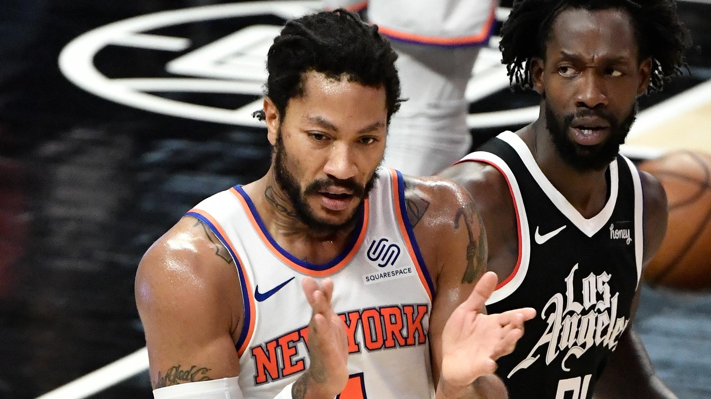 May 9, 2021; Los Angeles, California, USA; New York Knicks guard Derrick Rose (4) reacts to a referee's call going his way during the section quarter as LA Clippers guard Patrick Beverley (21) looks on at Staples Center. / © Robert Hanashiro-USA TODAY Sports