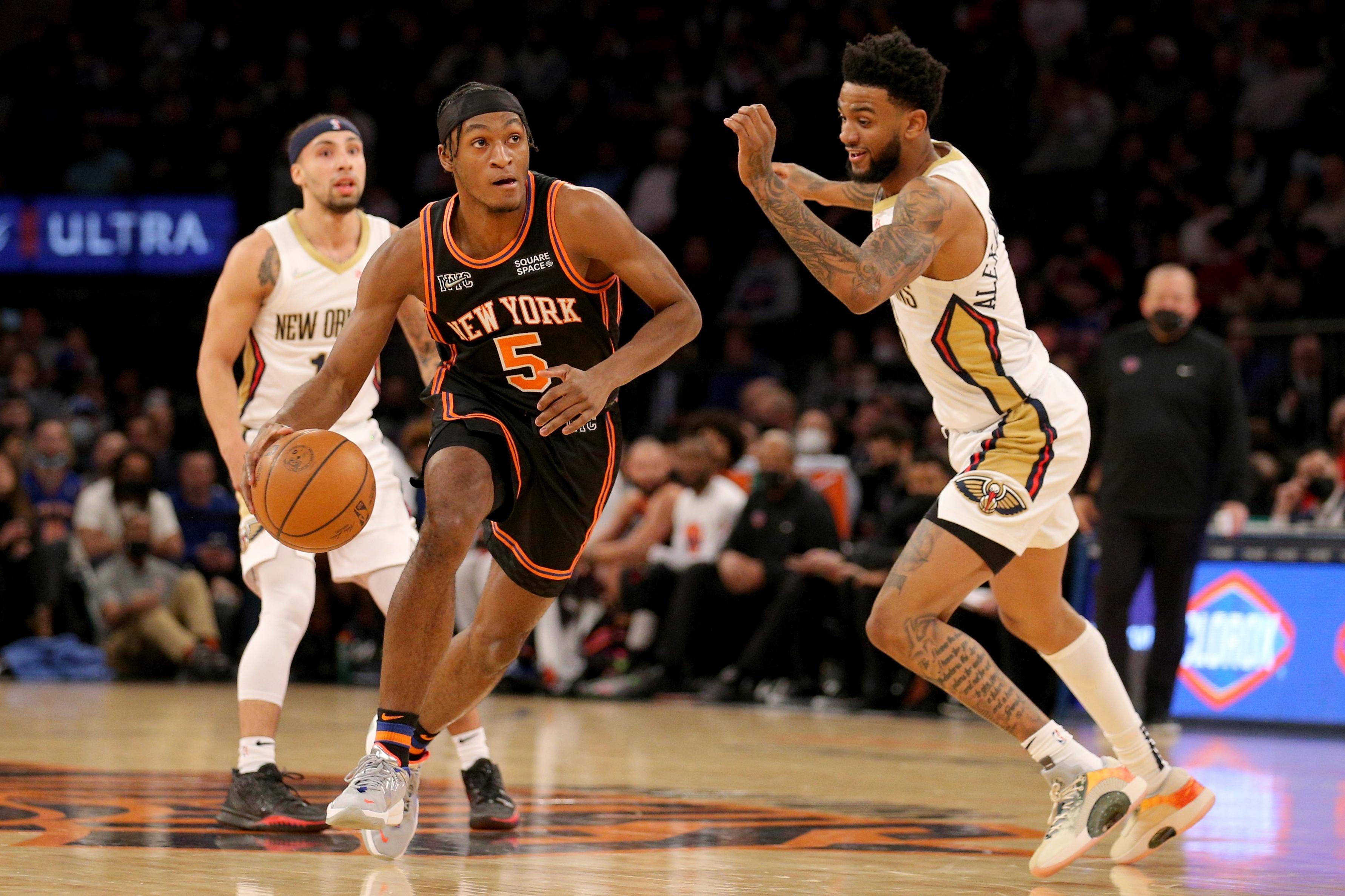 New York Knicks guard Immanuel Quickley (5) brings the ball up court against New Orleans Pelicans guard Nickeil Alexander-Walker (6) and guard Jose Alvarado (15) during the first quarter at Madison Square Garden. / Brad Penner-USA TODAY Sports