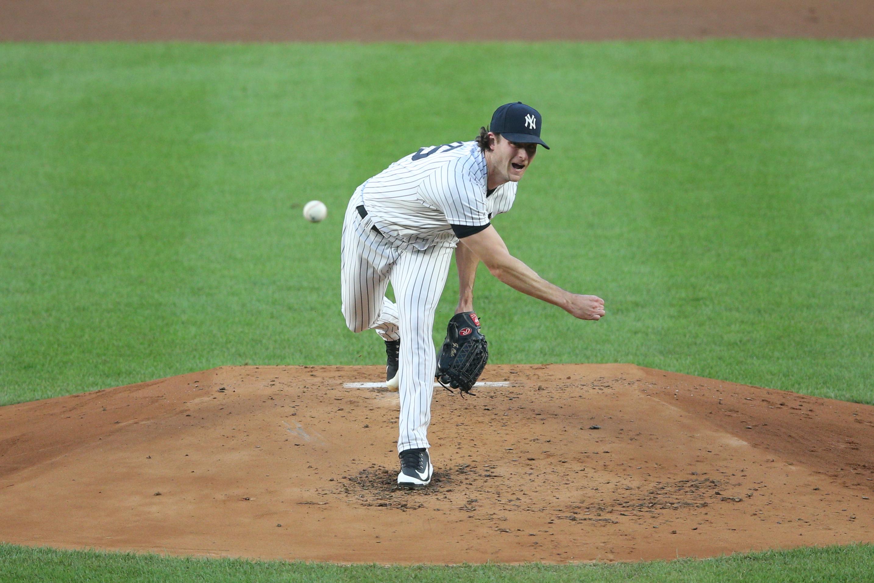 Aug 19, 2020; Bronx, New York, USA; New York Yankees starting pitcher Gerrit Cole (45) pitches against the Tampa Bay Rays during the second inning at Yankee Stadium. / Brad Penner-USA TODAY Sports
