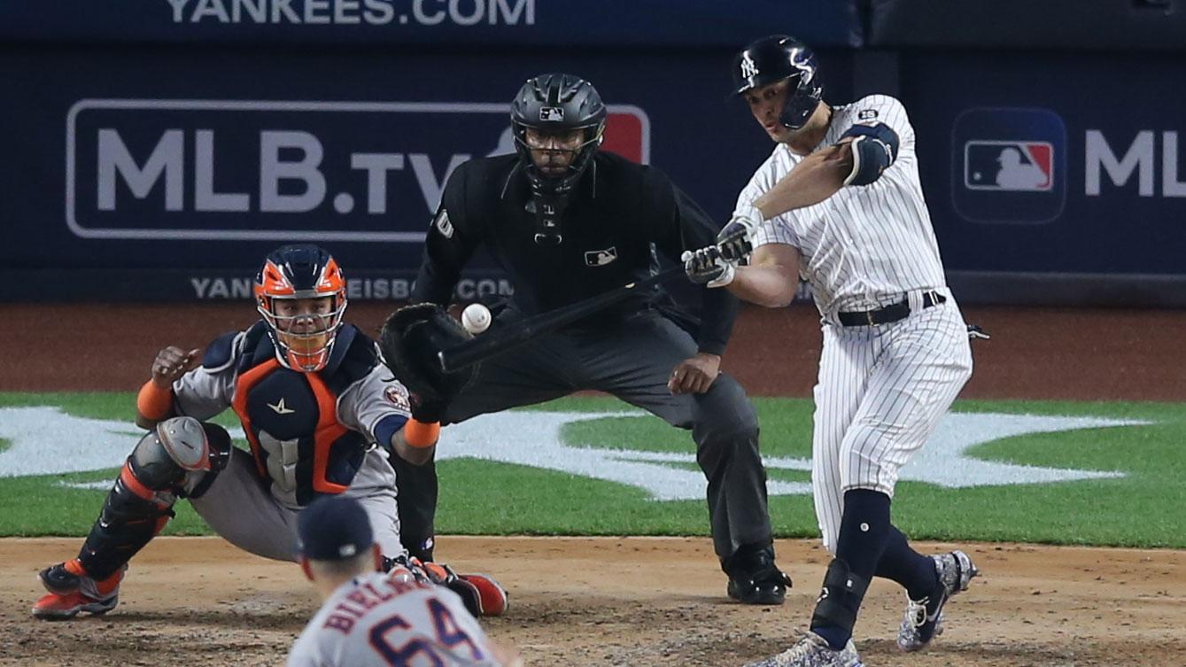 May 4, 2021; Bronx, New York, USA; New York Yankees designated hitter Giancarlo Stanton (27) hits a double against Houston Astros relief pitcher Brandon Bielak (64) during the fifth inning at Yankee Stadium. / Brad Penner-USA TODAY Sports