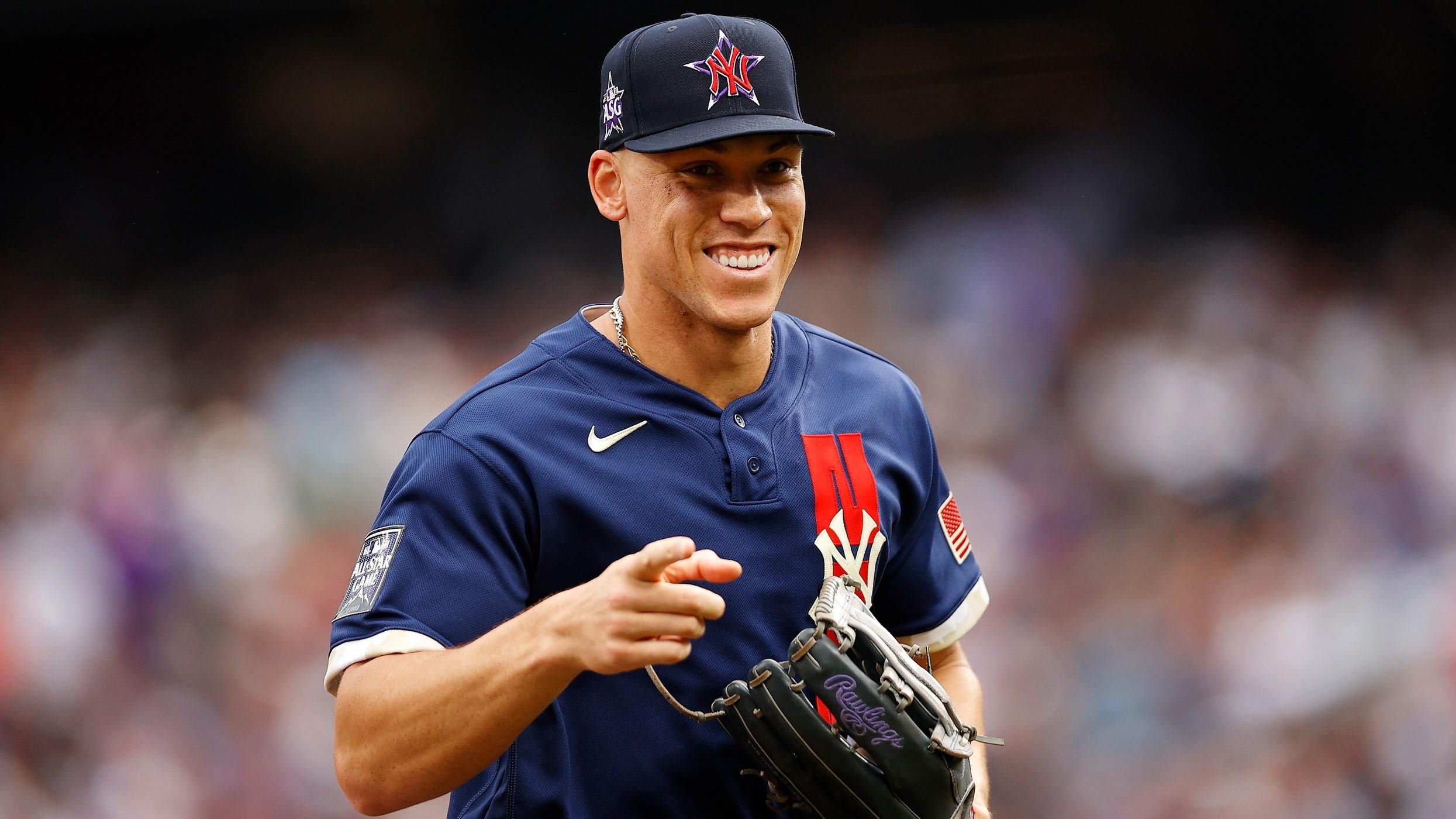 Jul 13, 2021; Denver, Colorado, USA; American League right fielder Aaron Judge of the New York Yankees (99) smiles and points as he runs back to the dugout after the second inning against the National League during the 2021 MLB All Star Game at Coors Field. / Isaiah J. Downing-USA TODAY Sports