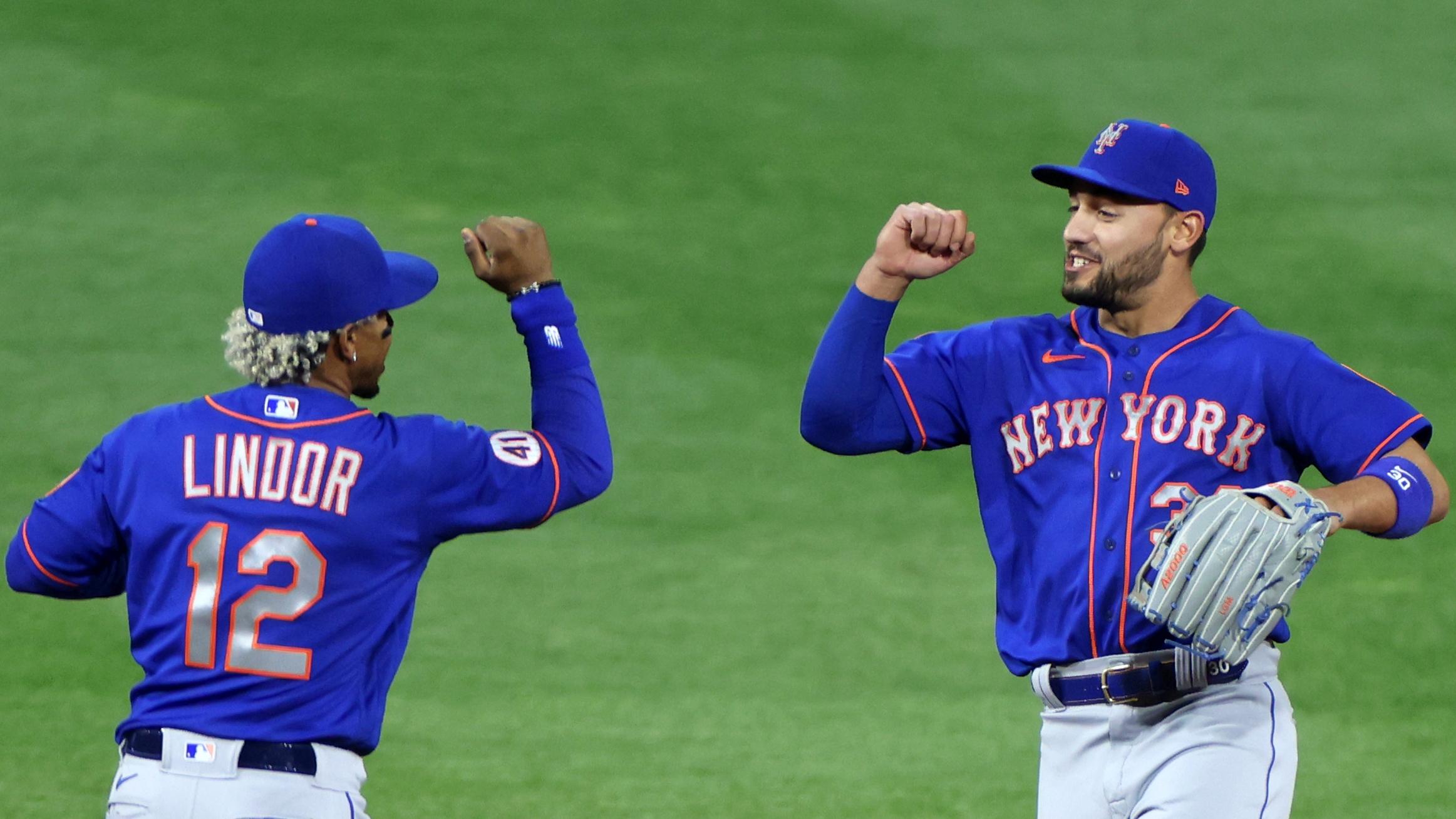 May 1, 2021; Philadelphia, Pennsylvania, USA; New York Mets shortstop Francisco Lindor (12) and right fielder Michael Conforto (30) celebrate victory over the Philadelphia Phillies at Citizens Bank Park. / Kam Nedd-USA TODAY Sports