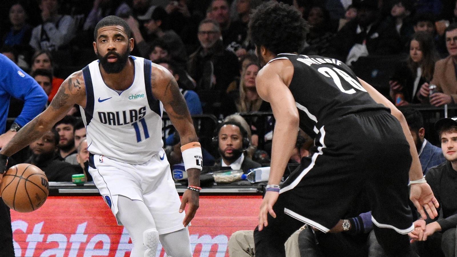 Dallas Mavericks guard Kyrie Irving (11) controls the ball as Brooklyn Nets guard Spencer Dinwiddie (26) defends during the second quarter at Barclays Center. / John Jones-USA TODAY Sports