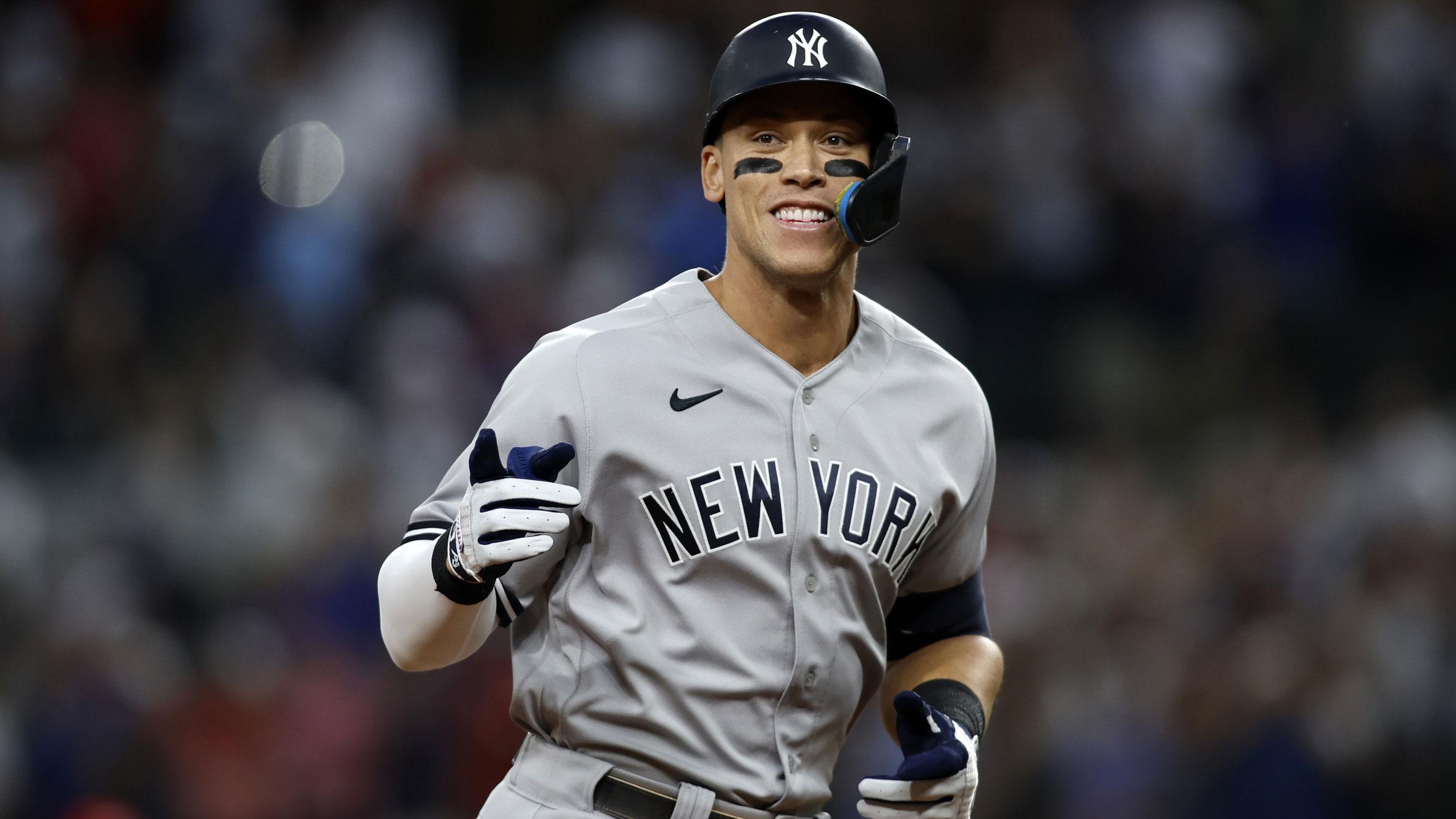 Oct 4, 2022; Arlington, Texas, USA; New York Yankees right fielder Aaron Judge (99) rounds the bases after hitting home run number sixty-two to break the American League home run record in the first inning against the Texas Rangers at Globe Life Field. / Tim Heitman-USA TODAY Sports