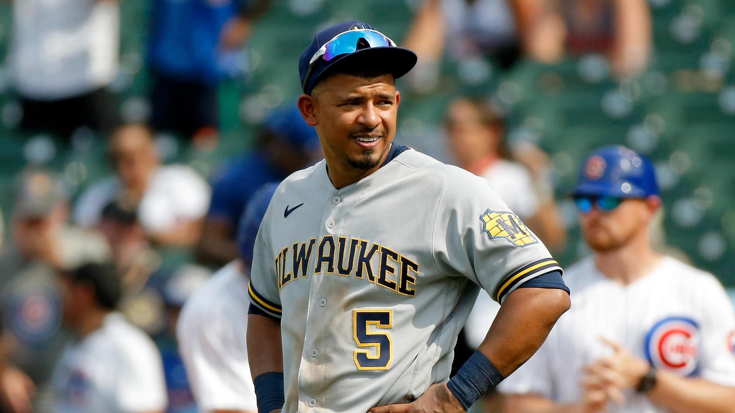 Aug 10, 2021; Chicago, Illinois, USA; Milwaukee Brewers first baseman Eduardo Escobar (5) reacts after a play against the Chicago Cubs during the seventh inning at Wrigley Field. / Jon Durr-USA TODAY Sports