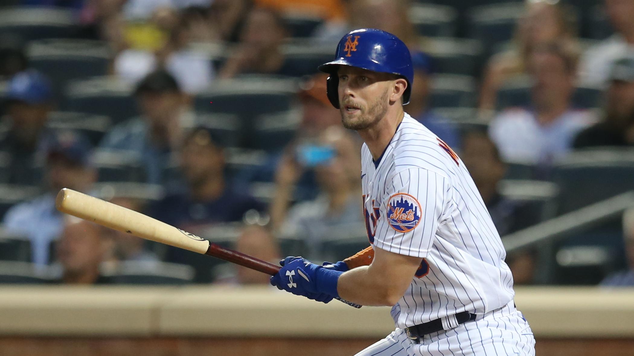 Jul 28, 2021; New York City, New York, USA; New York Mets second baseman Jeff McNeil (6) follows through on an RBI single against the Atlanta Braves during the third inning at Citi Field. / Brad Penner-USA TODAY Sports