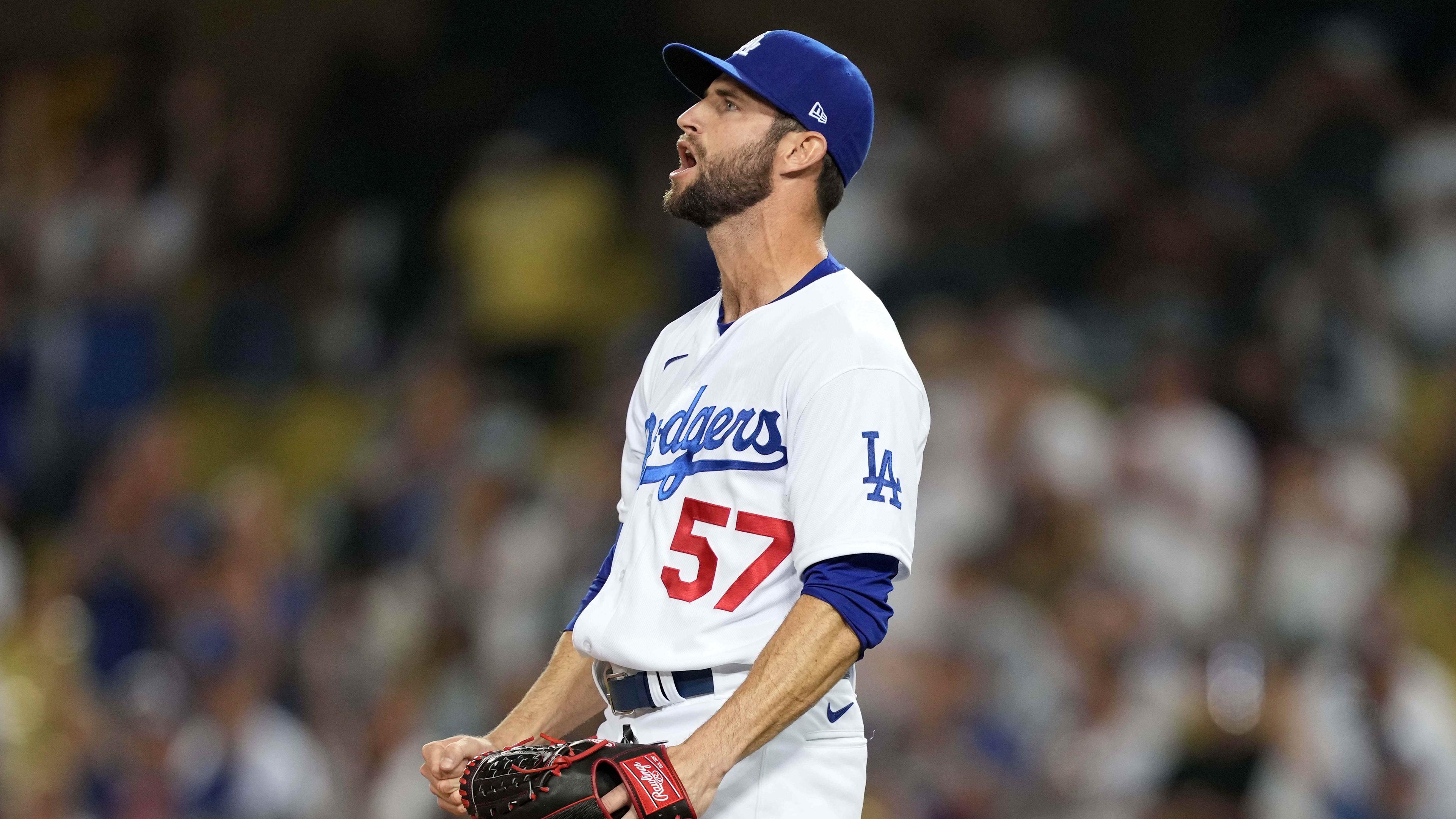 Jul 10, 2021; Los Angeles, California, USA; Los Angeles Dodgers relief pitcher Jake Reed (57) celebrates after defeating the Arizona Diamondback sat Dodger Stadium. / Kirby Lee-USA TODAY Sports