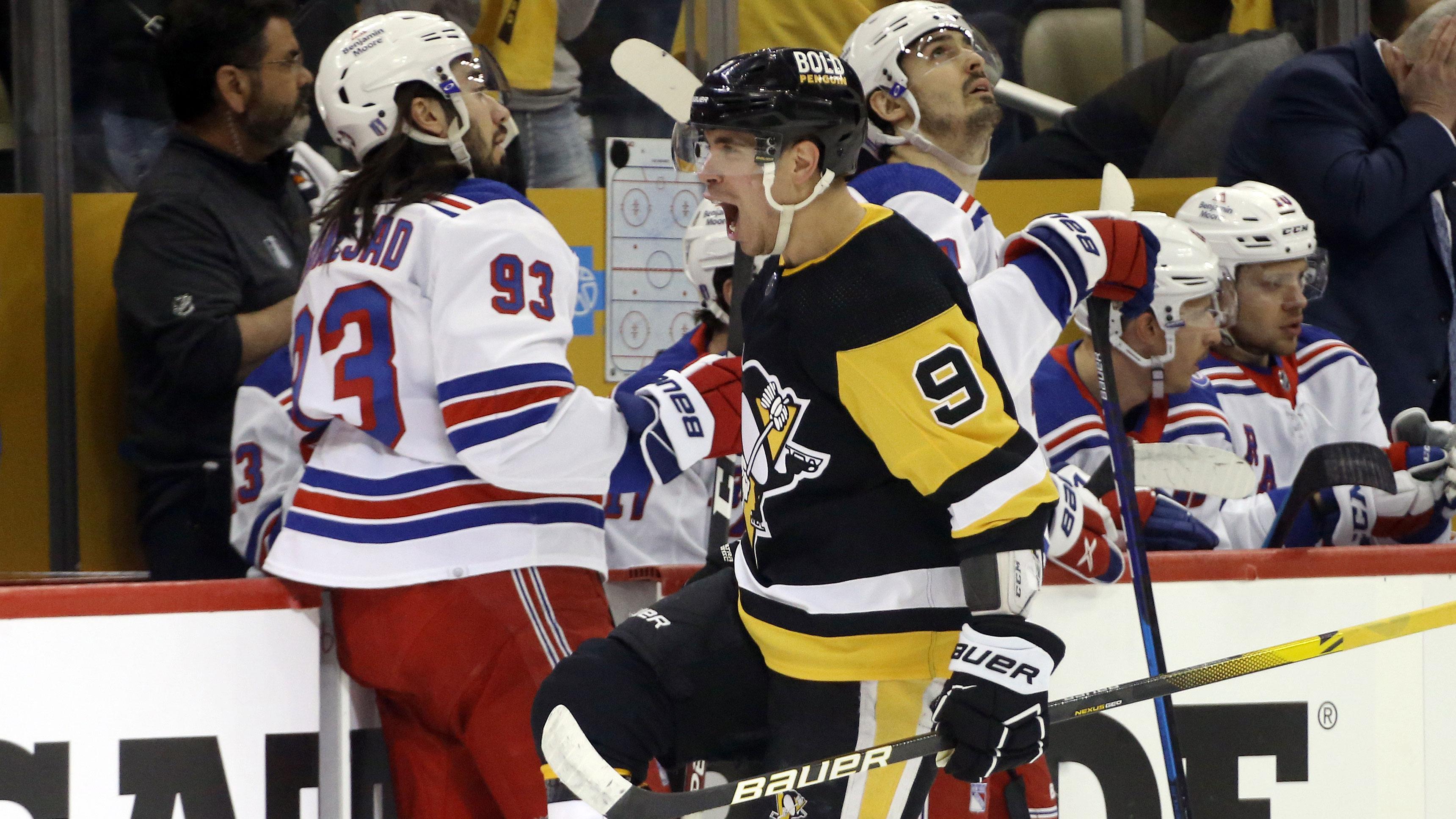May 7, 2022; Pittsburgh, Pennsylvania, USA; Pittsburgh Penguins center Evan Rodrigues (9) reacts after scoring a goal against the New York Rangers during the first period in game three of the first round of the 2022 Stanley Cup Playoffs at PPG Paints Arena. / Charles LeClaire-USA TODAY Sports