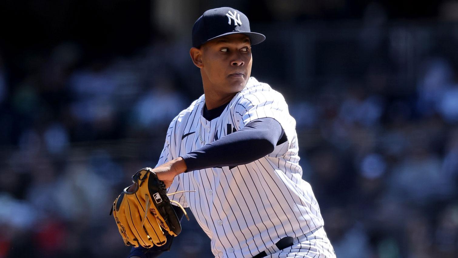 Apr 2, 2023; Bronx, New York, USA; New York Yankees starting pitcher Jhony Brito (76) pitches against the San Francisco Giants during the first inning at Yankee Stadium. / Brad Penner-USA TODAY Sports