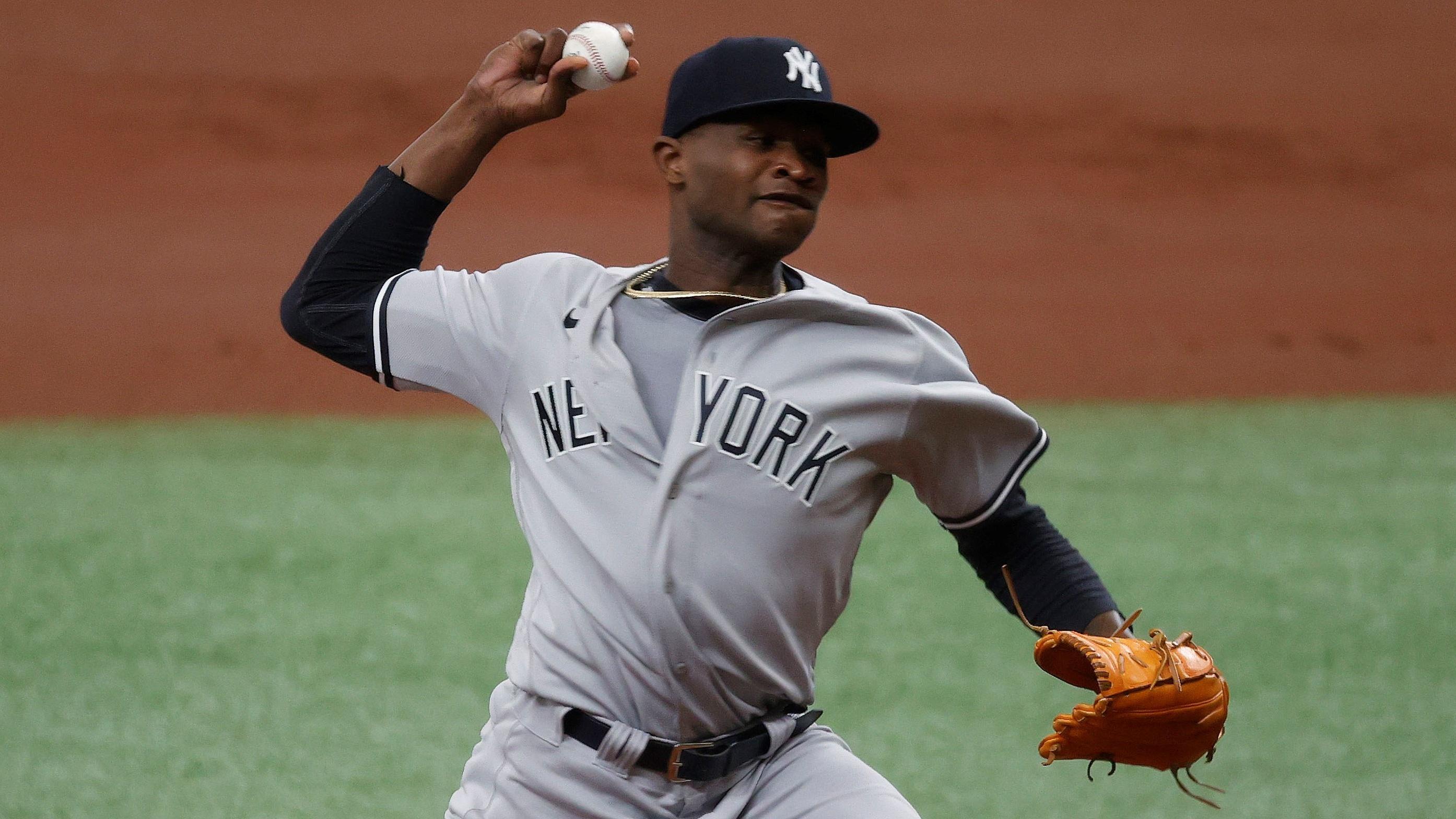 Apr 10, 2021; St. Petersburg, Florida, USA; New York Yankees starting pitcher Domingo German (55) throws a pitch during the first inning against the Tampa Bay Rays at Tropicana Field. / Kim Klement-USA TODAY Sports