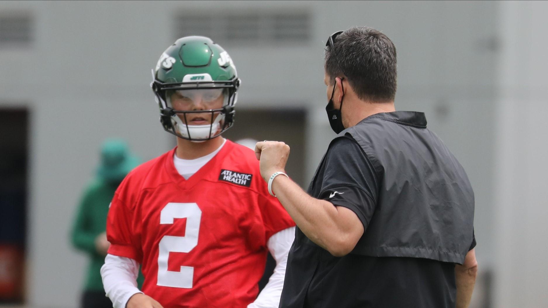 The new Jets quarterback Zach Wilson with Greg Knapp, passing game specialist at the NY Jets rookie mini camp in Florham Park, NJ on May 7, 2021. / Chris Pedota, NorthJersey.com