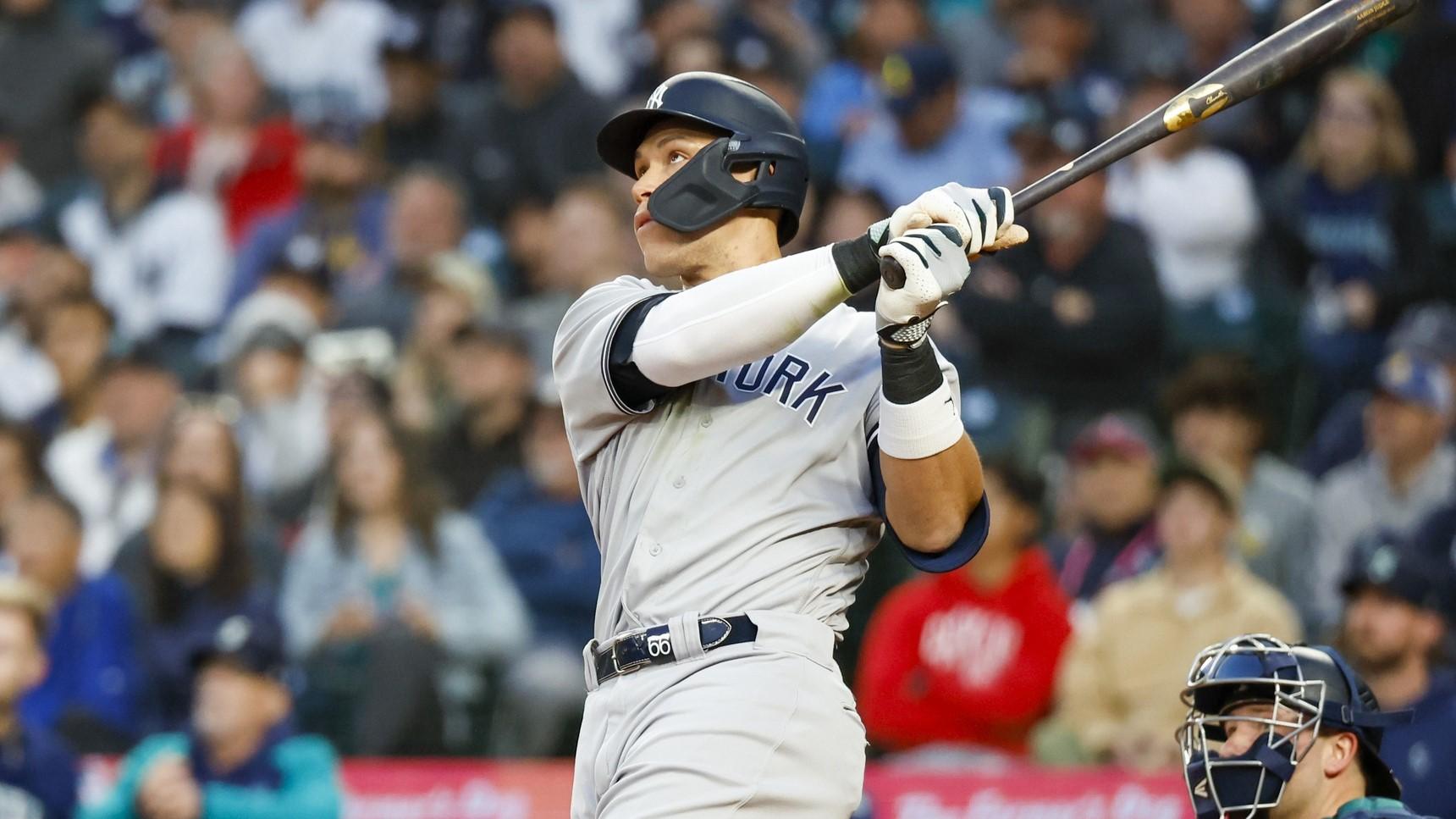 May 30, 2023; Seattle, Washington, USA; New York Yankees center fielder Aaron Judge (99) hits a solo-home run against the Seattle Mariners during the seventh inning at T-Mobile Park. / Joe Nicholson-USA TODAY Sports