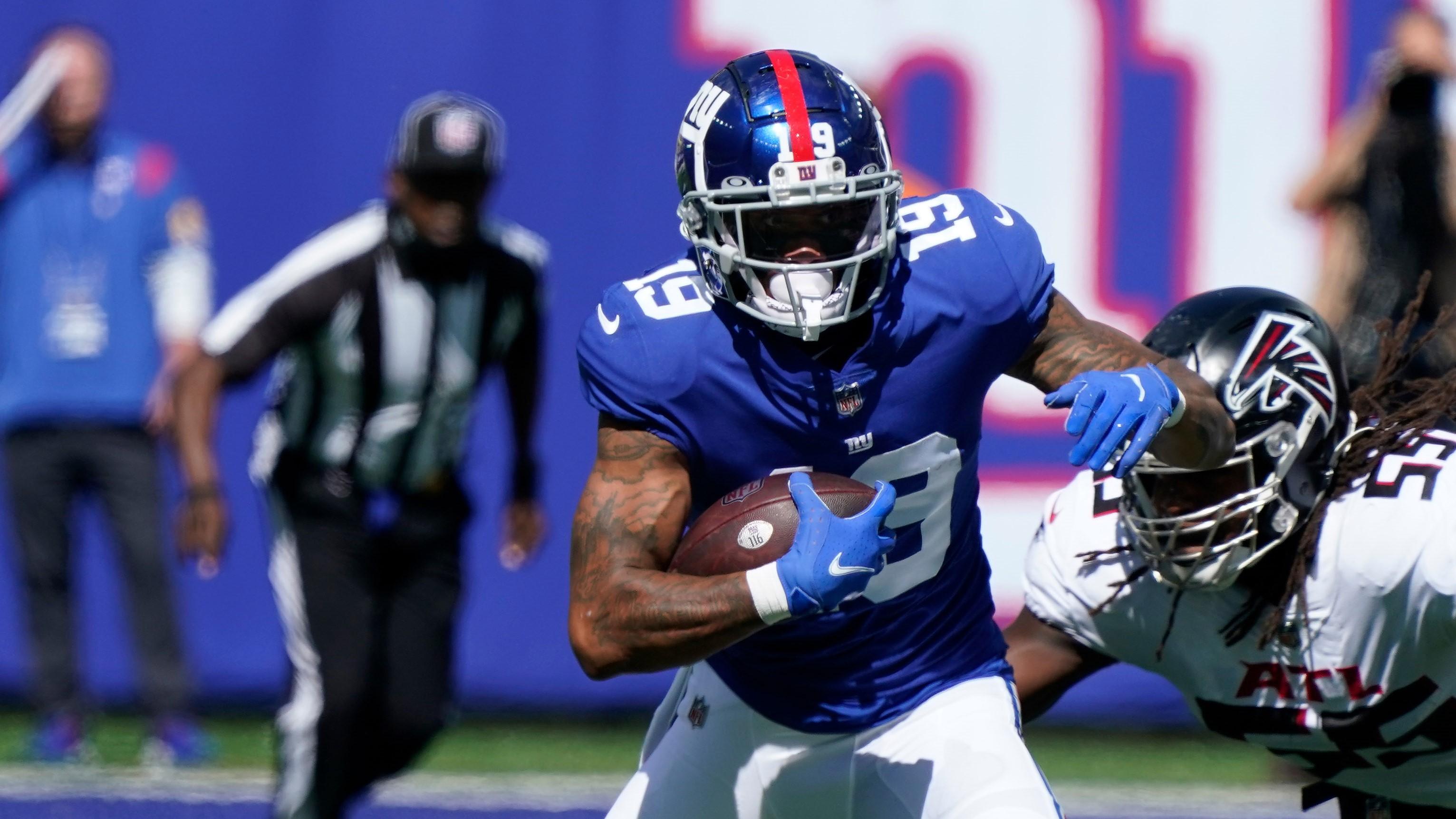 Sep 26, 2021; E. Rutherford, N.J., USA; New York Giants wide receiver Kenny Golladay (19) runs with the ball as Atlanta Falcons linebacker Steven Means (55) defends at MetLife Stadium. Mandatory Credit: Robert Deutsch-USA TODAY Sports / Robert Deutsch-USA TODAY Sports