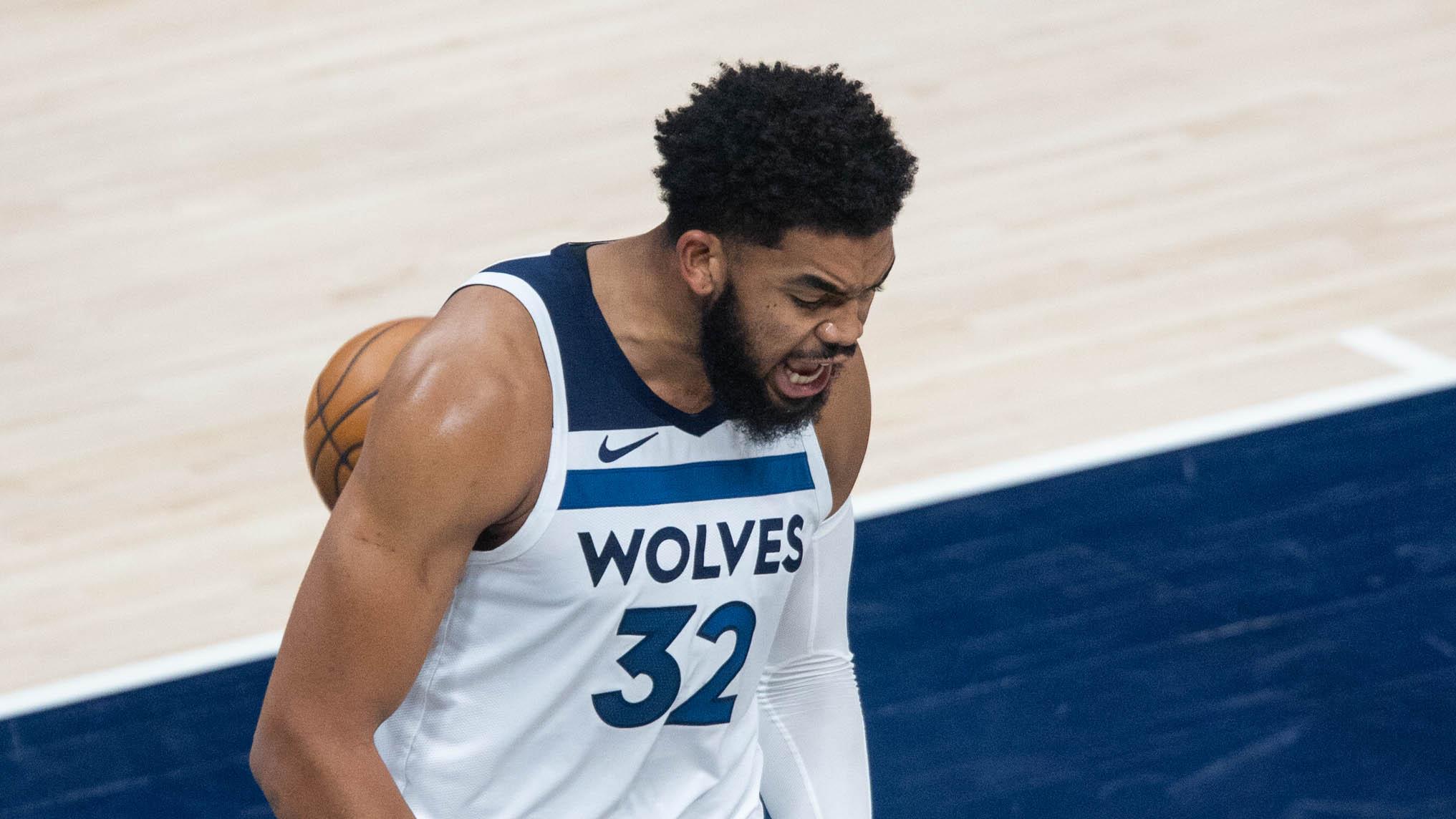 Minnesota Timberwolves center Karl-Anthony Towns (32) reacts to an and one basket in the third quarter against the Indiana Pacers at Bankers Life Fieldhouse. / Trevor Ruszkowski-USA TODAY Sports