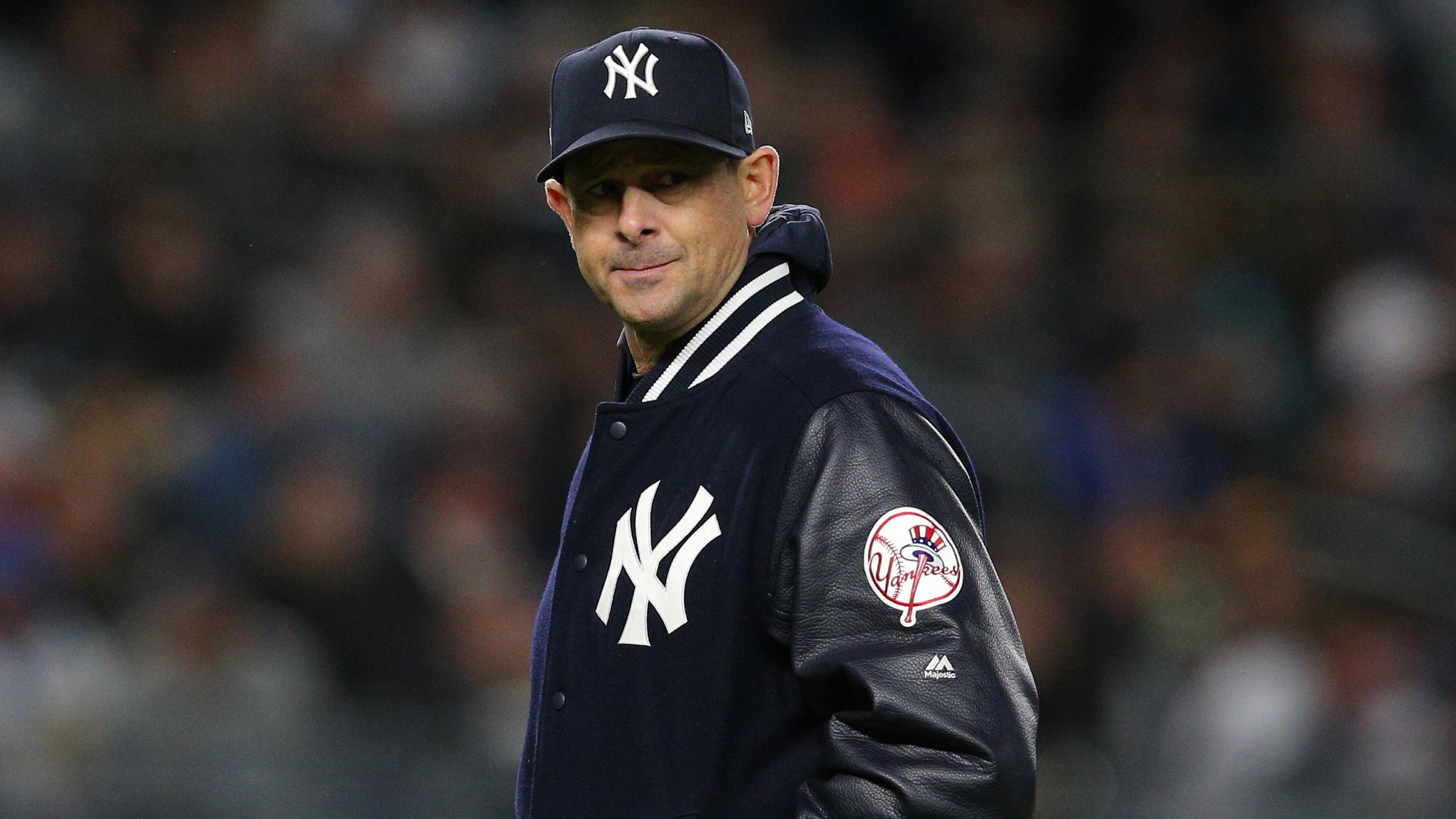 Oct 17, 2019; Bronx, NY, USA; New York Yankees manager Aaron Boone (17) leaves the mound after removing starting pitcher Masahiro Tanaka (not pictured) during the sixth inning of game four of the 2019 ALCS playoff baseball series against the Houston Astros at Yankee Stadium. / Brad Penner-USA TODAY Sports