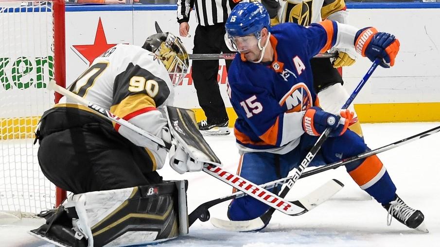 Dec 19, 2021; Elmont, New York, USA; Vegas Golden Knights goaltender Robin Lehner (90) makes a save 0n New York Islanders right wing Cal Clutterbuck (15) during the second period at UBS Arena. / Dennis Schneidler-USA TODAY Sports