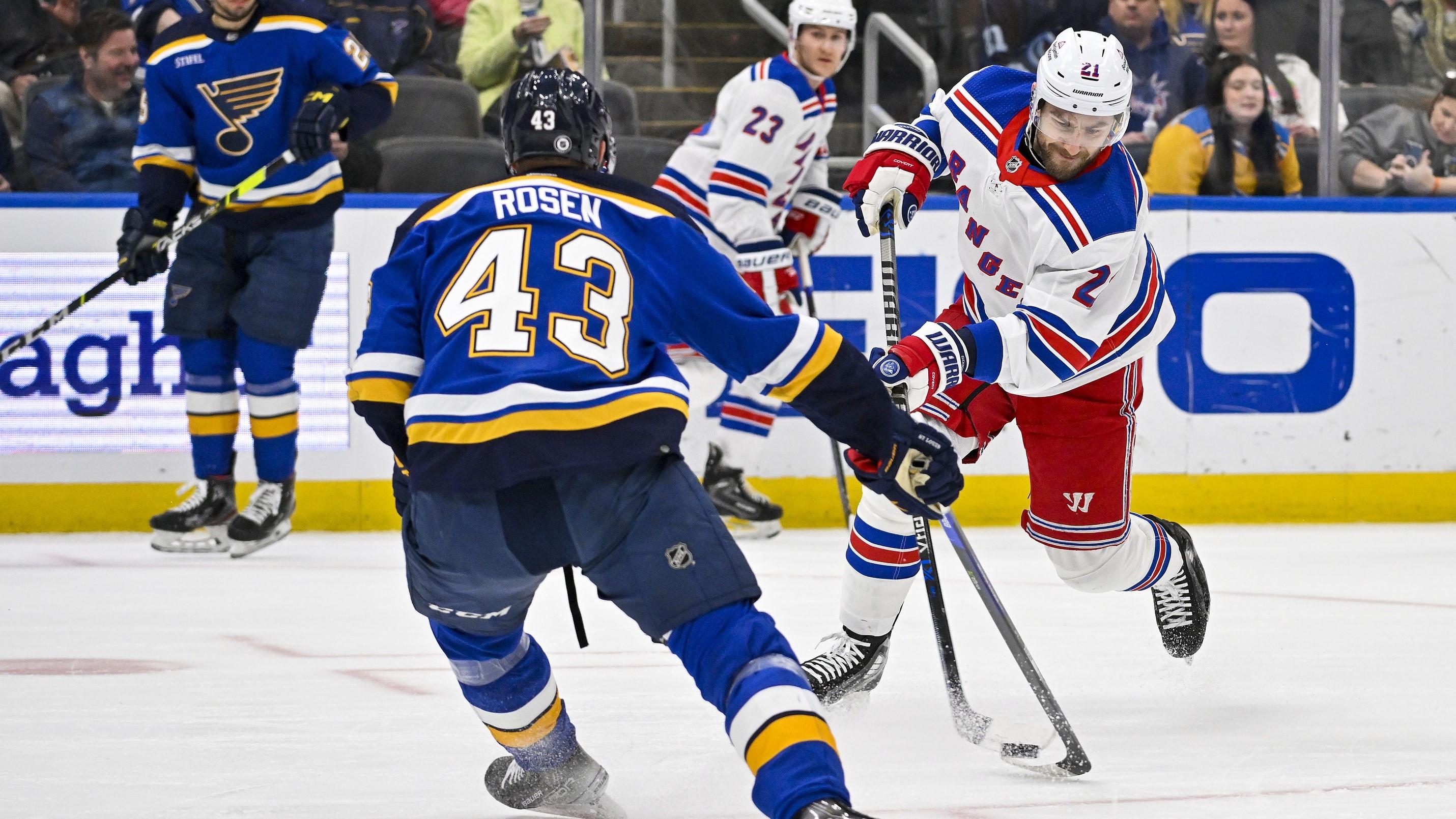 Apr 6, 2023; St. Louis, Missouri, USA; New York Rangers center Barclay Goodrow (21) shoots as St. Louis Blues defenseman Calle Rosen (43) defends during the first period at Enterprise Center. / Jeff Curry-USA TODAY Sports