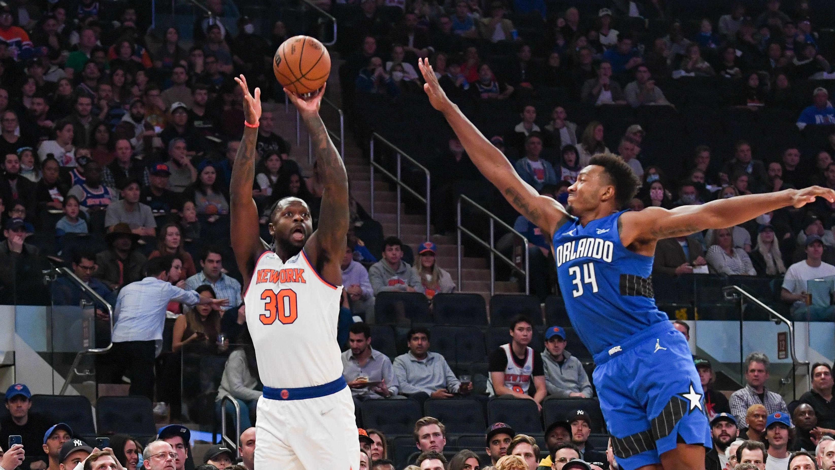 Oct 24, 2021; New York, New York, USA; New York Knicks forward Julius Randle (30)attempts a three pointer defended by Orlando Magic center Wendell Carter Jr. (34) during the first quarter at Madison Square Garden. Mandatory Credit: Dennis Schneidler-USA TODAY Sports / Dennis Schneidler-USA TODAY Sports