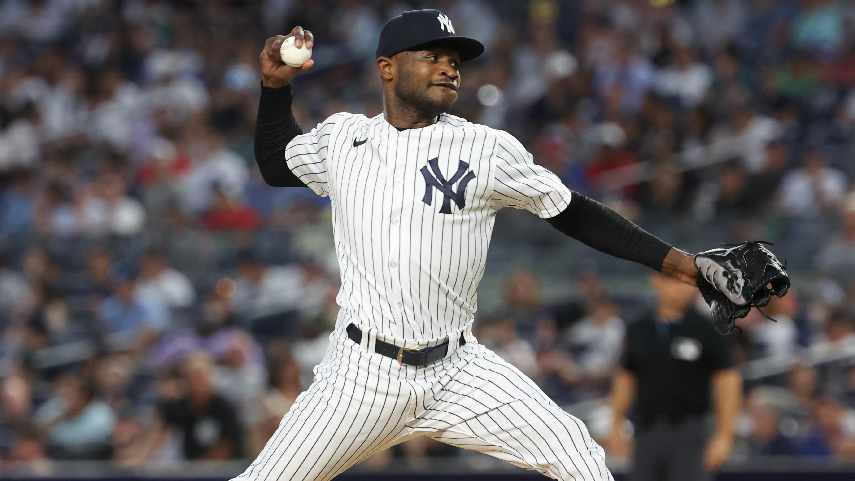 New York Yankees starting pitcher Domingo German (0) delivers a pitch during the seventh inning against the Tampa Bay Rays at Yankee Stadium / Vincent Carchietta - USA TODAY Sports
