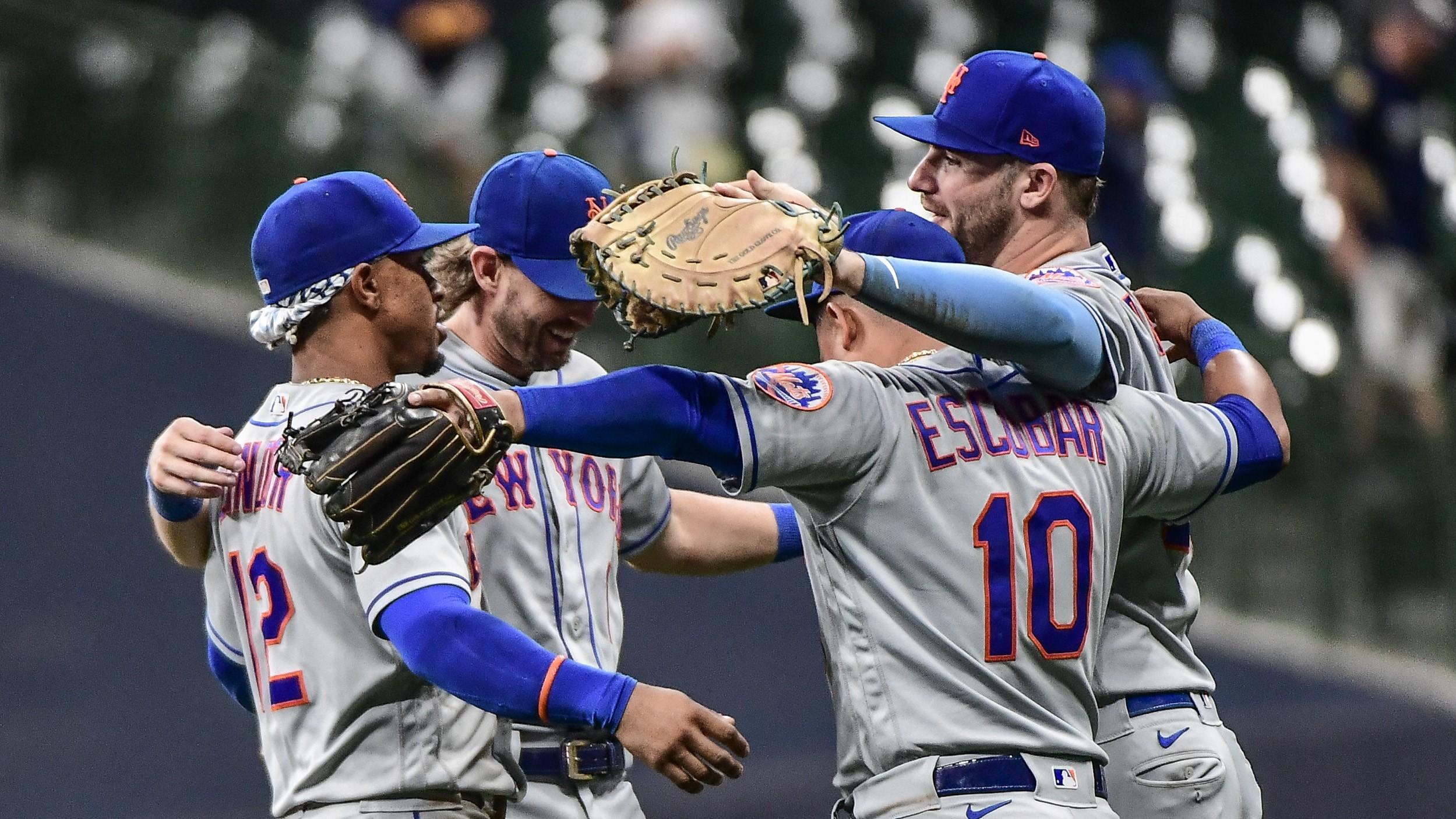 Sep 19, 2022; Milwaukee, Wisconsin, USA; The New York Mets celebrates after clinching a playoff spot by beating the Milwaukee Brewers at American Family Field. Mandatory Credit: Benny Sieu-USA TODAY Sports / © Benny Sieu-USA TODAY Sports