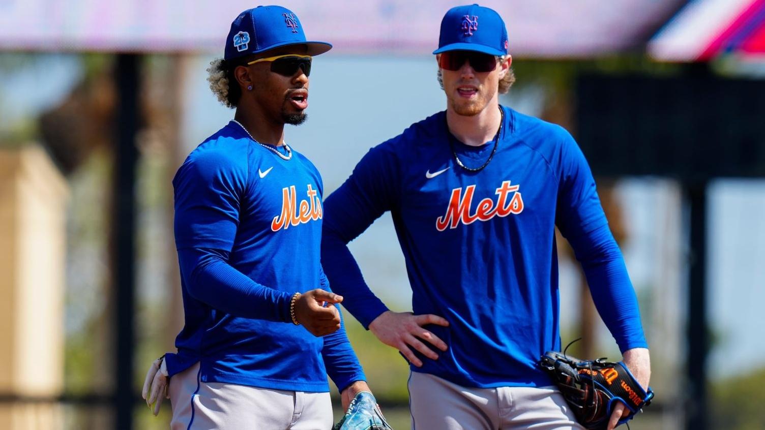 Feb 27, 2023; Jupiter, Florida, USA; New York Mets shortstop Francisco Lindor (12) and third baseman Brett Baty (22) warm up prior to a game against the St. Louis Cardinals at Roger Dean Stadium. / Rich Storry-USA TODAY Sports
