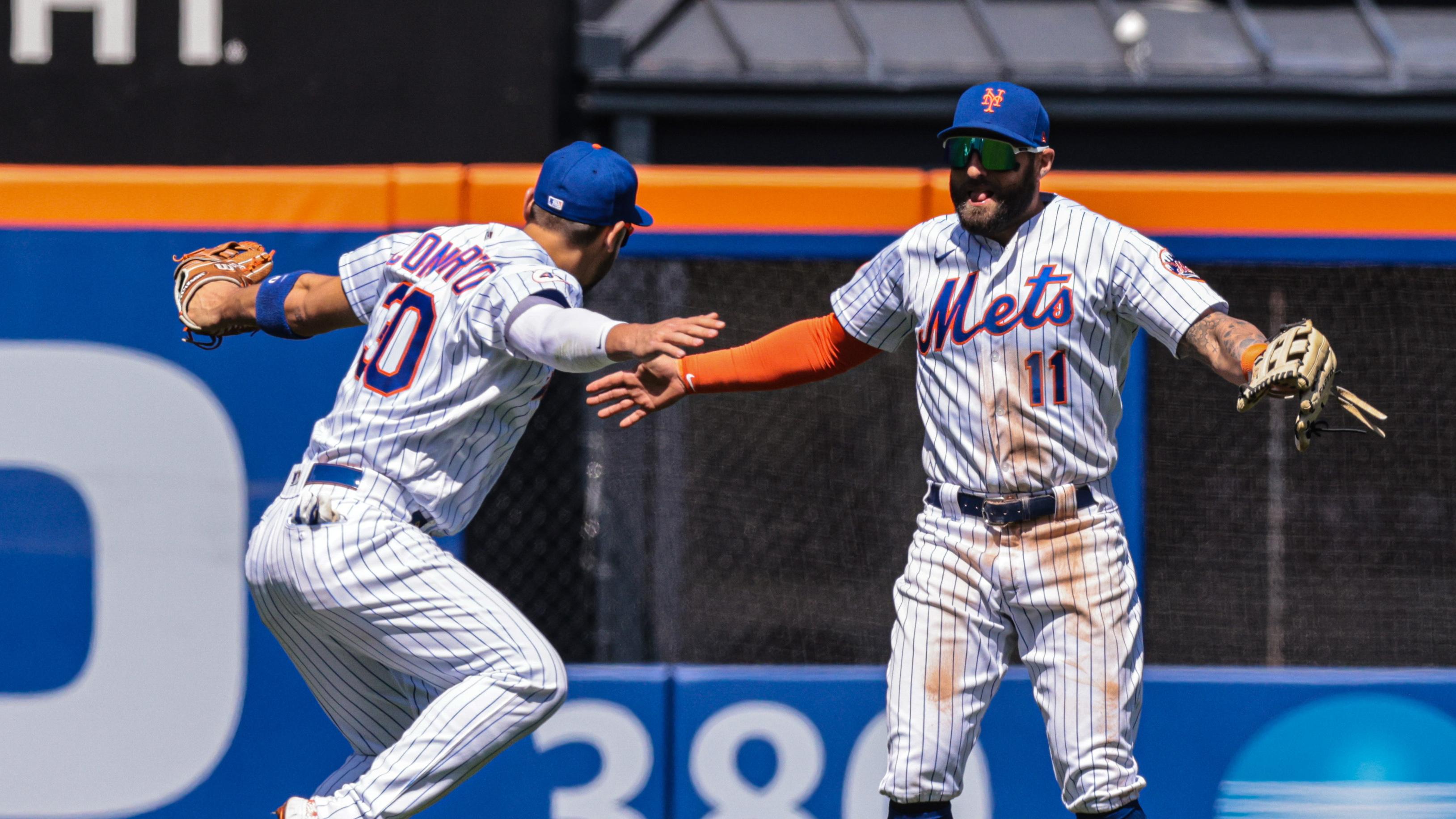 New York Mets center fielder Kevin Pillar (11) celebrates with right fielder Michael Conforto (30) after their game against the Baltimore Orioles at Citi Field. / Vincent Carchietta-USA TODAY Sports