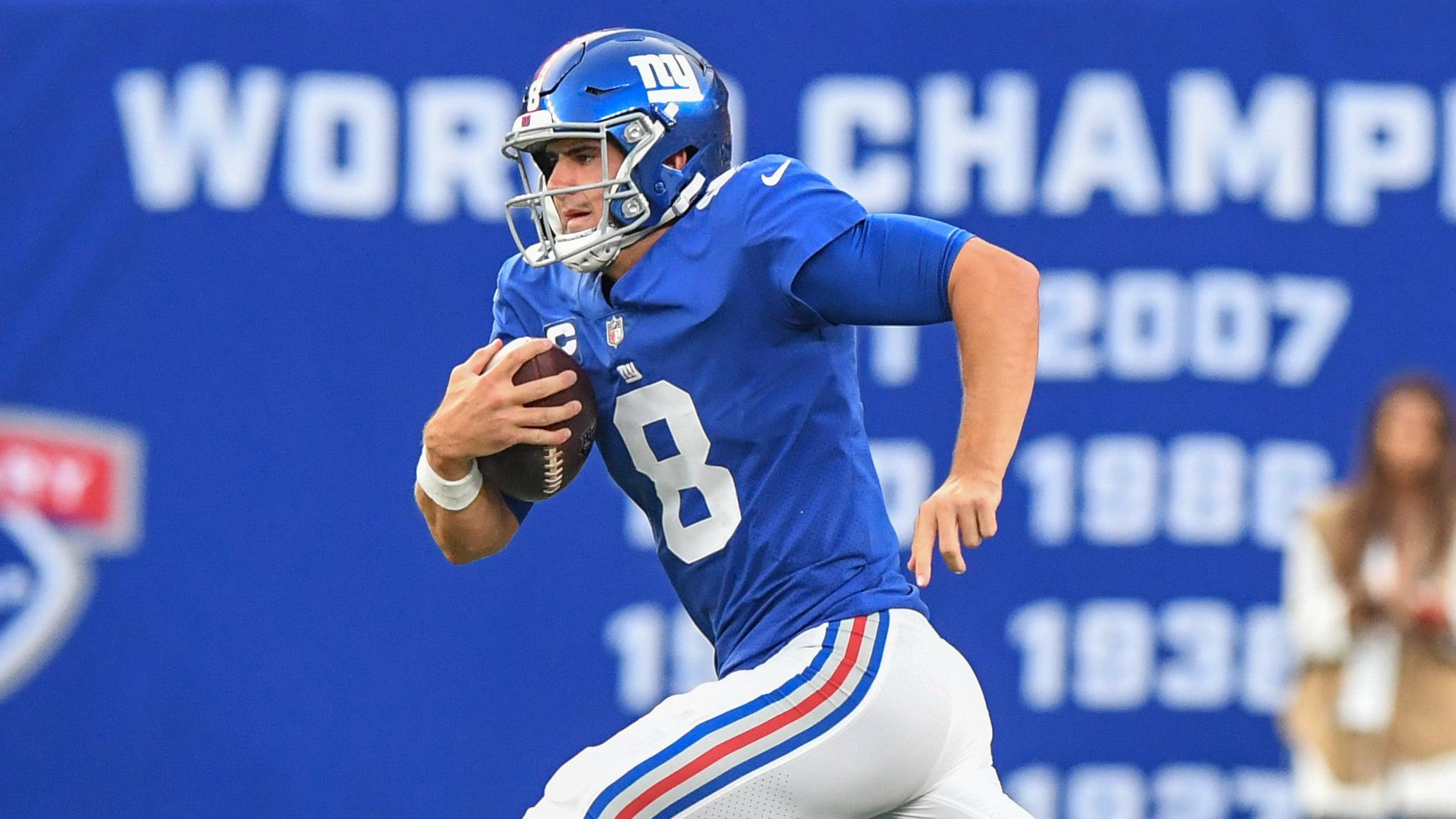 Sep 12, 2021; East Rutherford, New Jersey, USA; New York Giants quarterback Daniel Jones (8) runs the ball against the Denver Broncos during the second half at MetLife Stadium. / Dennis Schneidler-USA TODAY Sports
