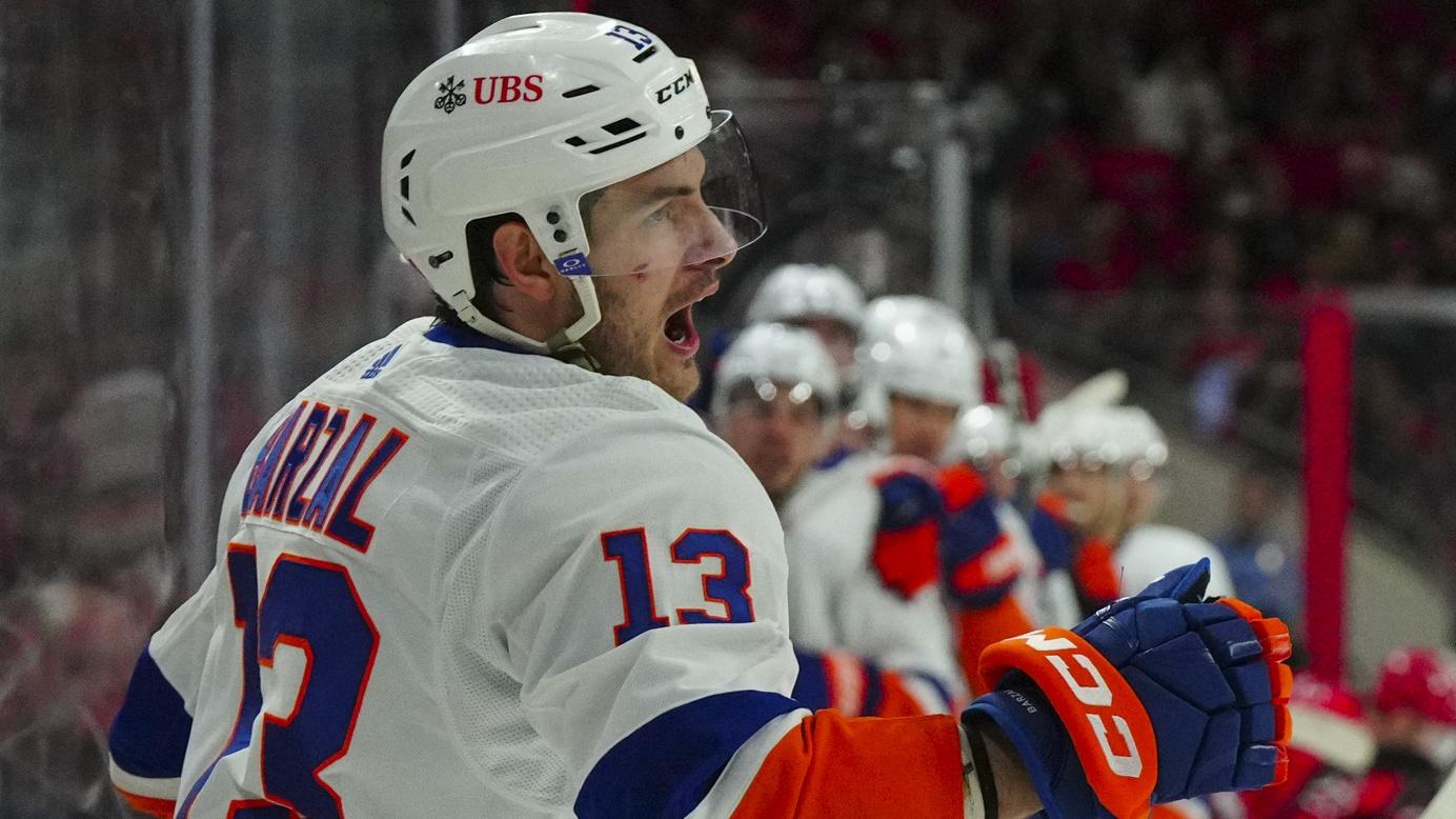 New York Islanders center Mathew Barzal (13) celebrates his goal against the Carolina Hurricanes during the second period in game five of the first round of the 2023 Stanley Cup Playoffs at PNC Arena / James Guillory - USA TODAY Sports