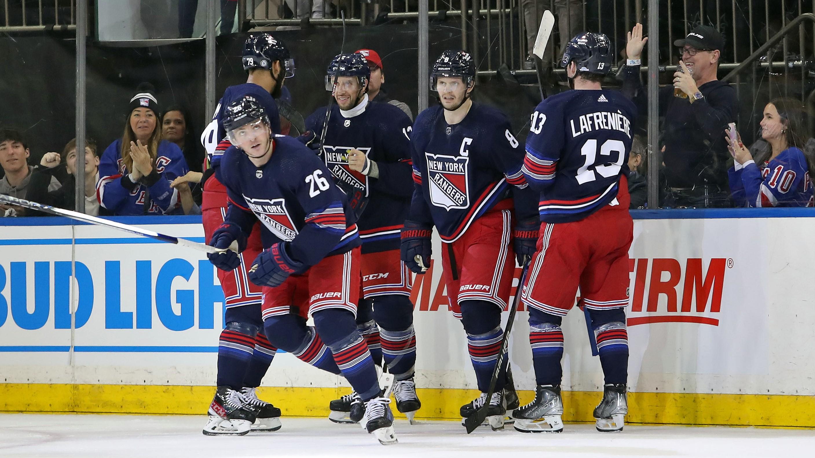 Dec 10, 2023; New York, New York, USA; New York Rangers left wing Jimmy Vesey (26) celebrates his goal with center Nick Bonino (12), forward Alexis Lafreniere (13), defenseman K'Andre Miller (79) and defenseman Jacob Trouba (8) during the second period against the Los Angeles Kings at Madison Square Garden. Mandatory Credit: Danny Wild-USA TODAY Sports / © Danny Wild-USA TODAY Sports