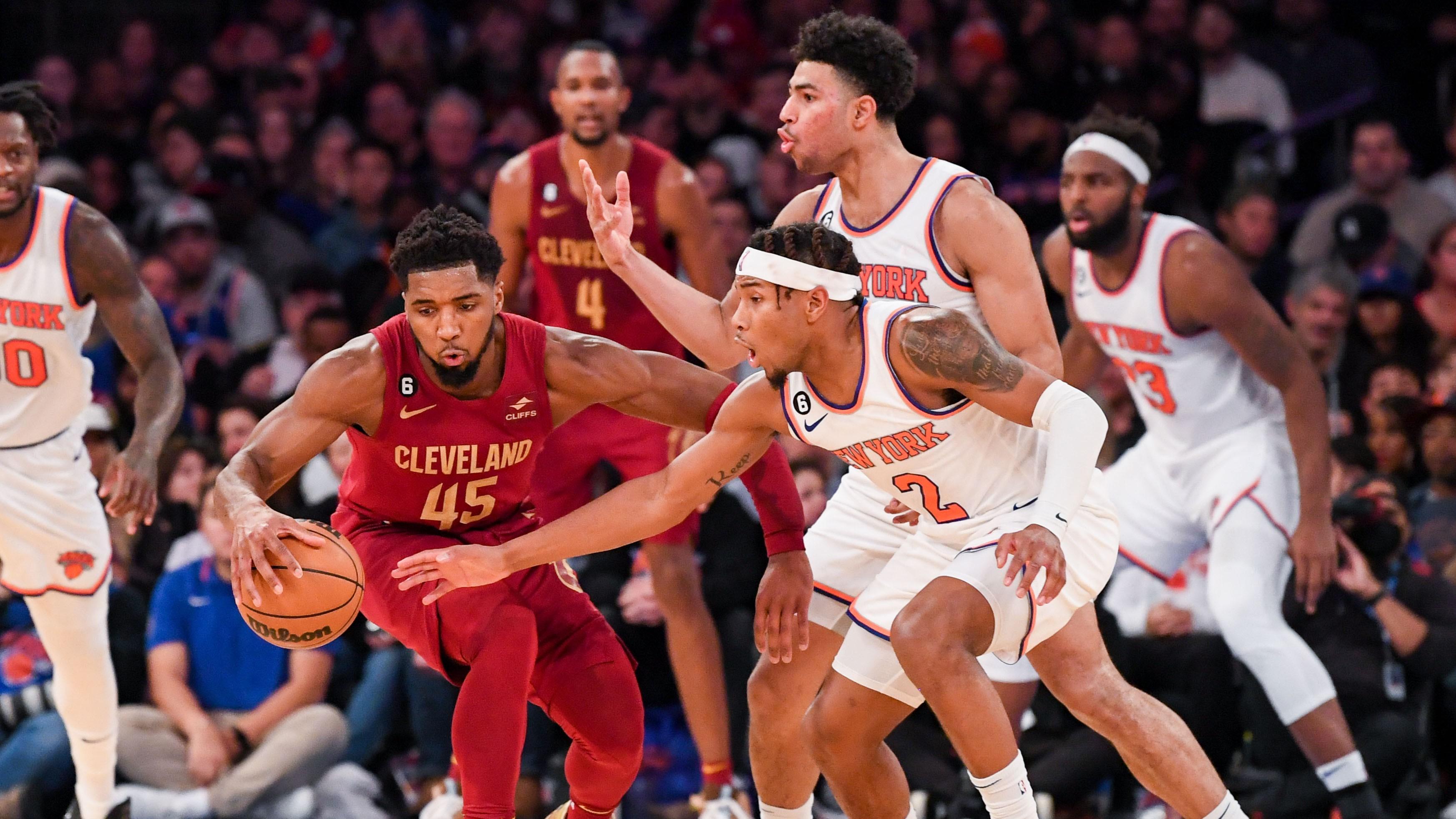 Dec 4, 2022; New York, New York, USA; New York Knicks guard Miles McBride (2) defends against Cleveland Cavaliers guard Donovan Mitchell (45) during the fourth quarter at Madison Square Garden. Mandatory Credit: Dennis Schneidler-USA TODAY Sports / © Dennis Schneidler-USA TODAY Sports