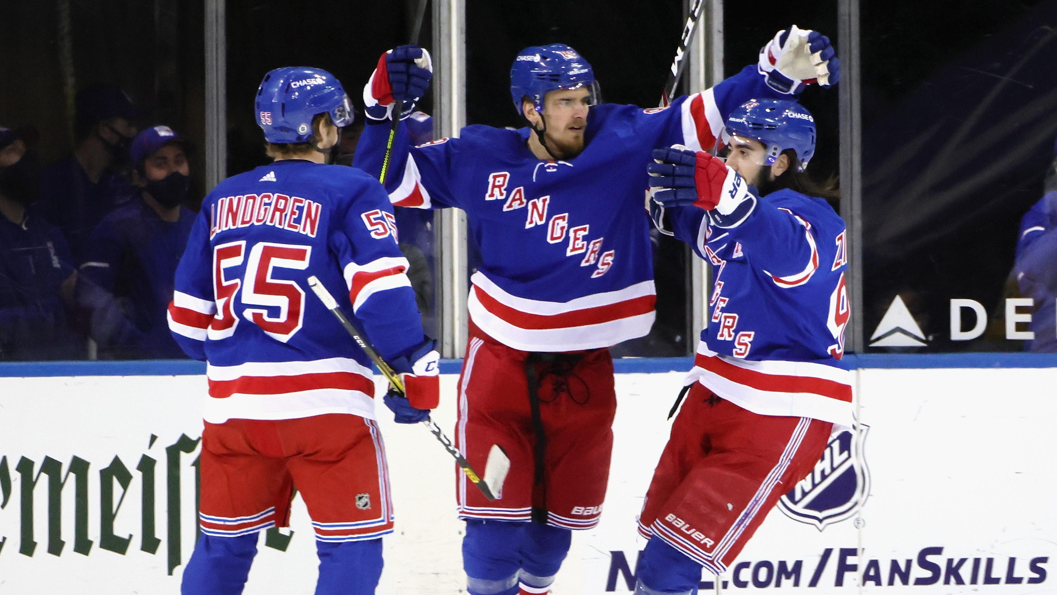 Apr 6, 2021; New York, New York, USA; Mika Zibanejad #93 of the New York Rangers (R) celebrates his goal at 7:28 of the first period against the Pittsburgh Penguins and is joined by Ryan Lindgren #55 (L) and Pavel Buchnevich #89 (C) at Madison Square Garden on April 06, 2021 in New York City.. / © POOL PHOTOS-USA TODAY Sports