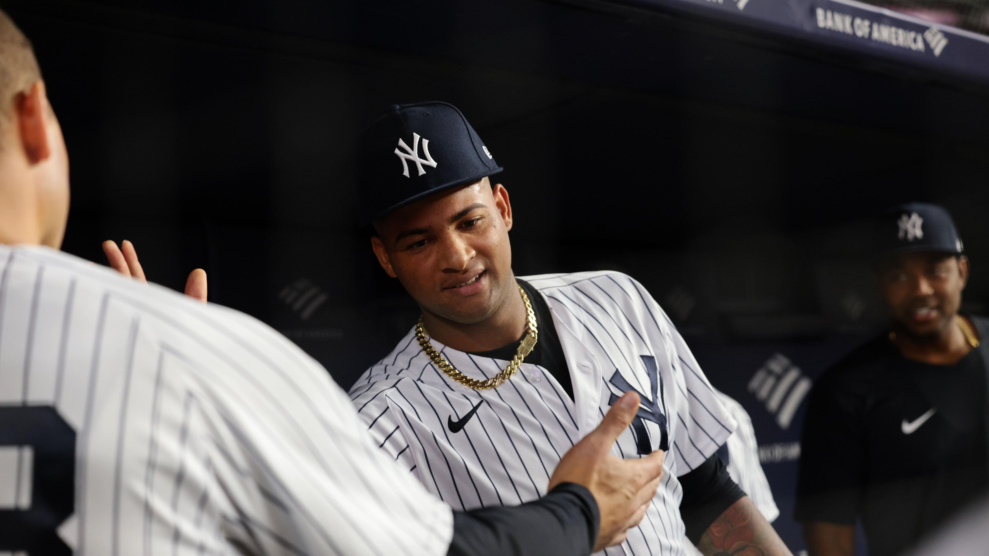 New York Yankees starting pitcher Luis Gil (81) is congratulated by teammates after the top of the sixth inning against the Baltimore Orioles at Yankee Stadium. / Vincent Carchietta-USA TODAY Sports