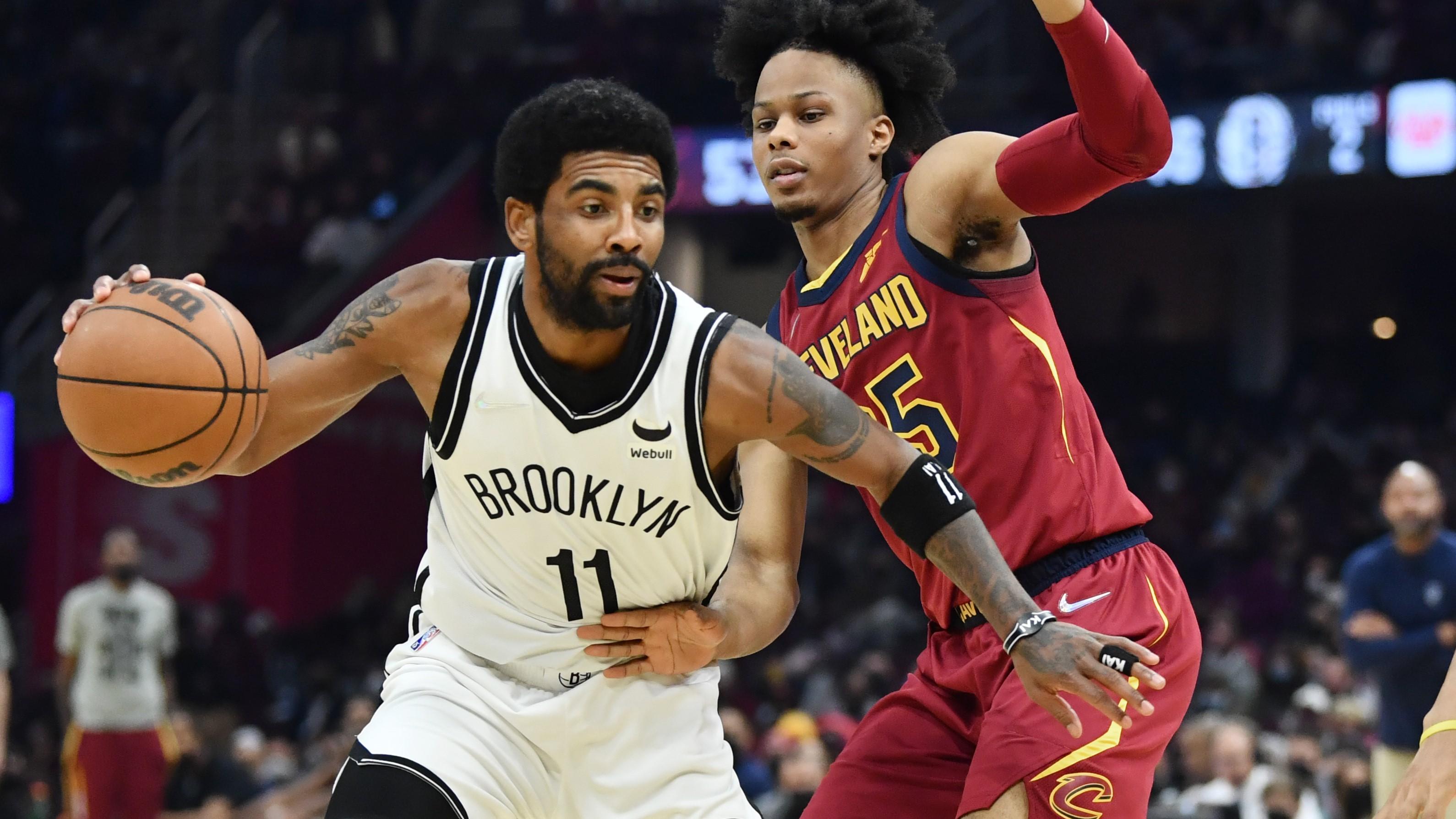 Jan 17, 2022; Cleveland, Ohio, USA; Cleveland Cavaliers forward Isaac Okoro (35) defends Brooklyn Nets guard Kyrie Irving (11) during the first half at Rocket Mortgage FieldHouse. / Ken Blaze-USA TODAY Sports