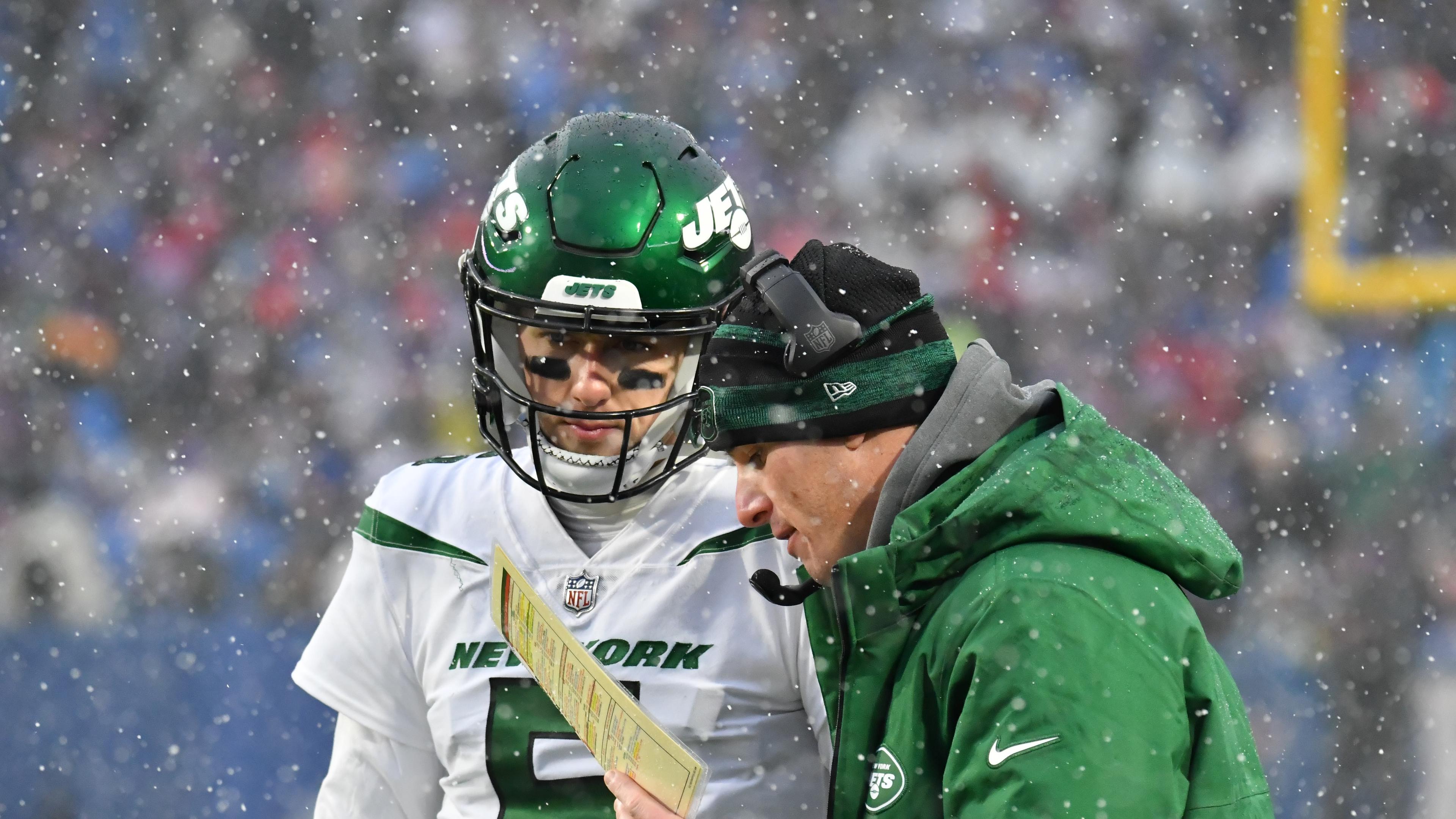 Dec 11, 2022; Orchard Park, New York, USA; New York Jets offensive coordinator Mike LaFleur talks with quarterback Mike White (5) during a timeout in the fourth quarter game against the Buffalo Bills at Highmark Stadium. Mandatory Credit: Mark Konezny-USA TODAY Sports / © Mark Konezny-USA TODAY Sports