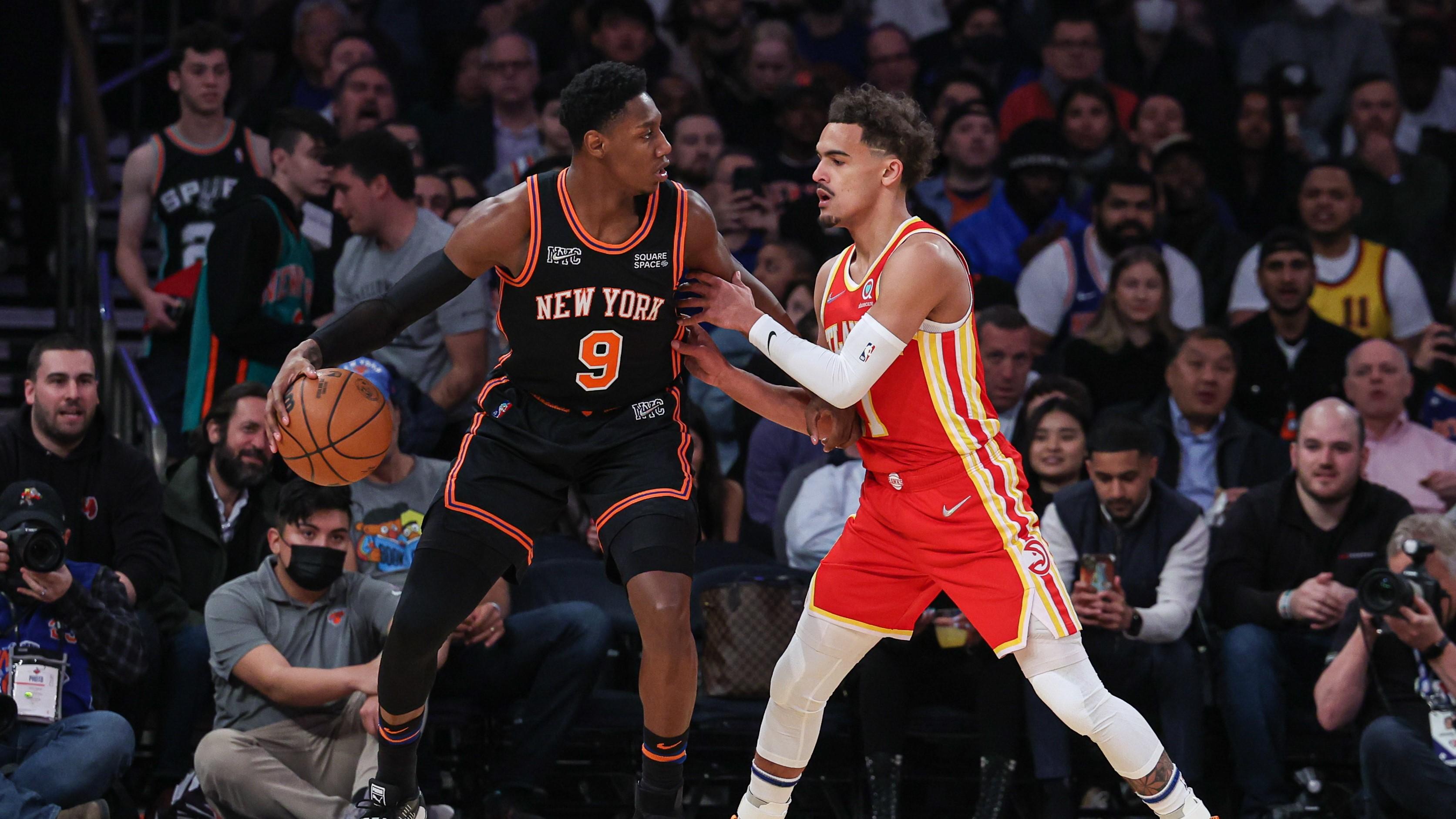 Mar 22, 2022; New York, New York, USA; New York Knicks guard RJ Barrett (9) dribbles against Atlanta Hawks guard Trae Young (11) during the first quarter at Madison Square Garden. / Vincent Carchietta-USA TODAY Sports