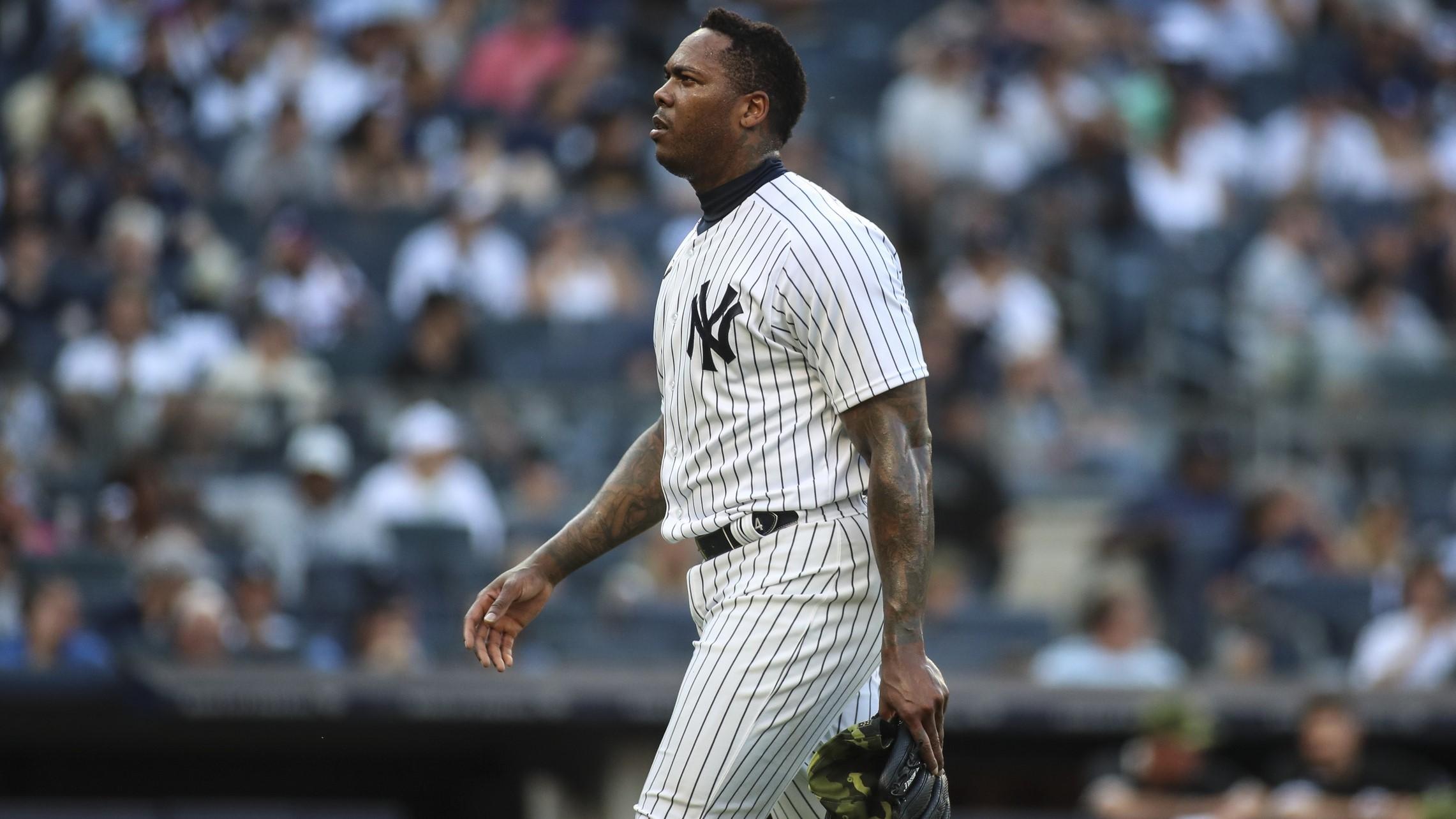 May 22, 2022; Bronx, New York, USA; New York Yankees relief pitcher Aroldis Chapman (54) walks off the mound in the ninth inning after blowing a save against the Chicago White Sox at Yankee Stadium. / Wendell Cruz-USA TODAY Sports