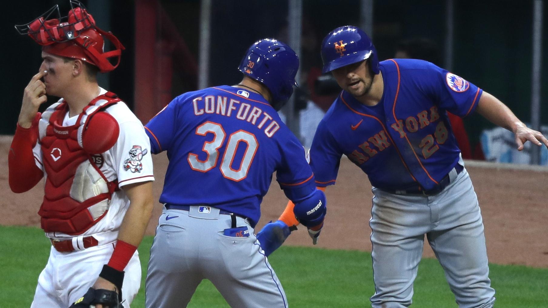 Jul 19, 2021; Cincinnati, Ohio, USA; New York Mets right fielder Michael Conforto (30) reacts with third baseman J.D. Davis (28) after Conforto hit a two-run home run against the Cincinnati Reds during the fourth inning at Great American Ball Park. / © David Kohl-USA TODAY Sports