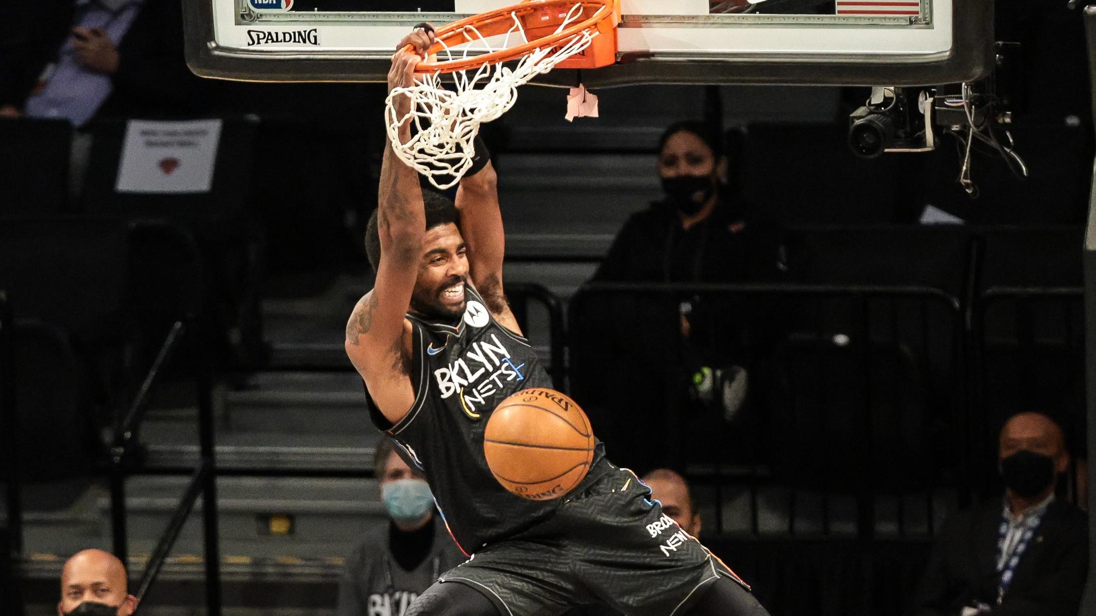 Apr 5, 2021; Brooklyn, New York, USA; Brooklyn Nets guard Kyrie Irving (11) dunks the ball against the New York Knicks during the second half at Barclays Center. / Vincent Carchietta-USA TODAY Sports