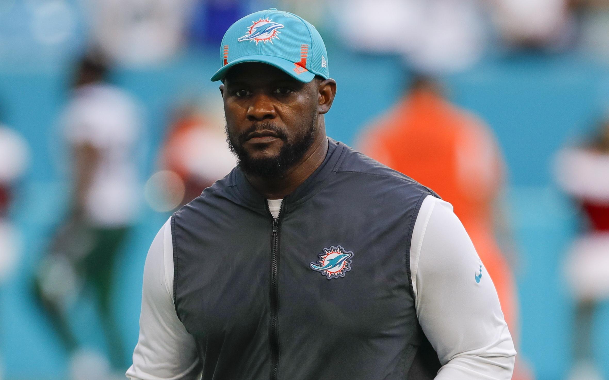 Dec 19, 2021; Miami Gardens, Florida, USA; Miami Dolphins head coach Brian Flores runs off the field after winning the game against the New York Jets at Hard Rock Stadium. Mandatory Credit: Sam Navarro-USA TODAY Sports / © Sam Navarro-USA TODAY Sports
