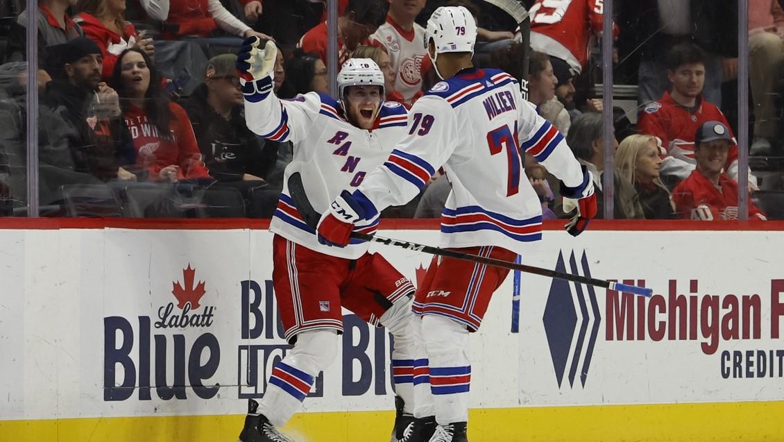 Mar 30, 2022; Detroit, Michigan, USA; New York Rangers center Andrew Copp (18) celebrates with defenseman K Andre Miller (79) after scoring in overtime against the Detroit Red Wings at Little Caesars Arena. / Rick Osentoski-USA TODAY Sports