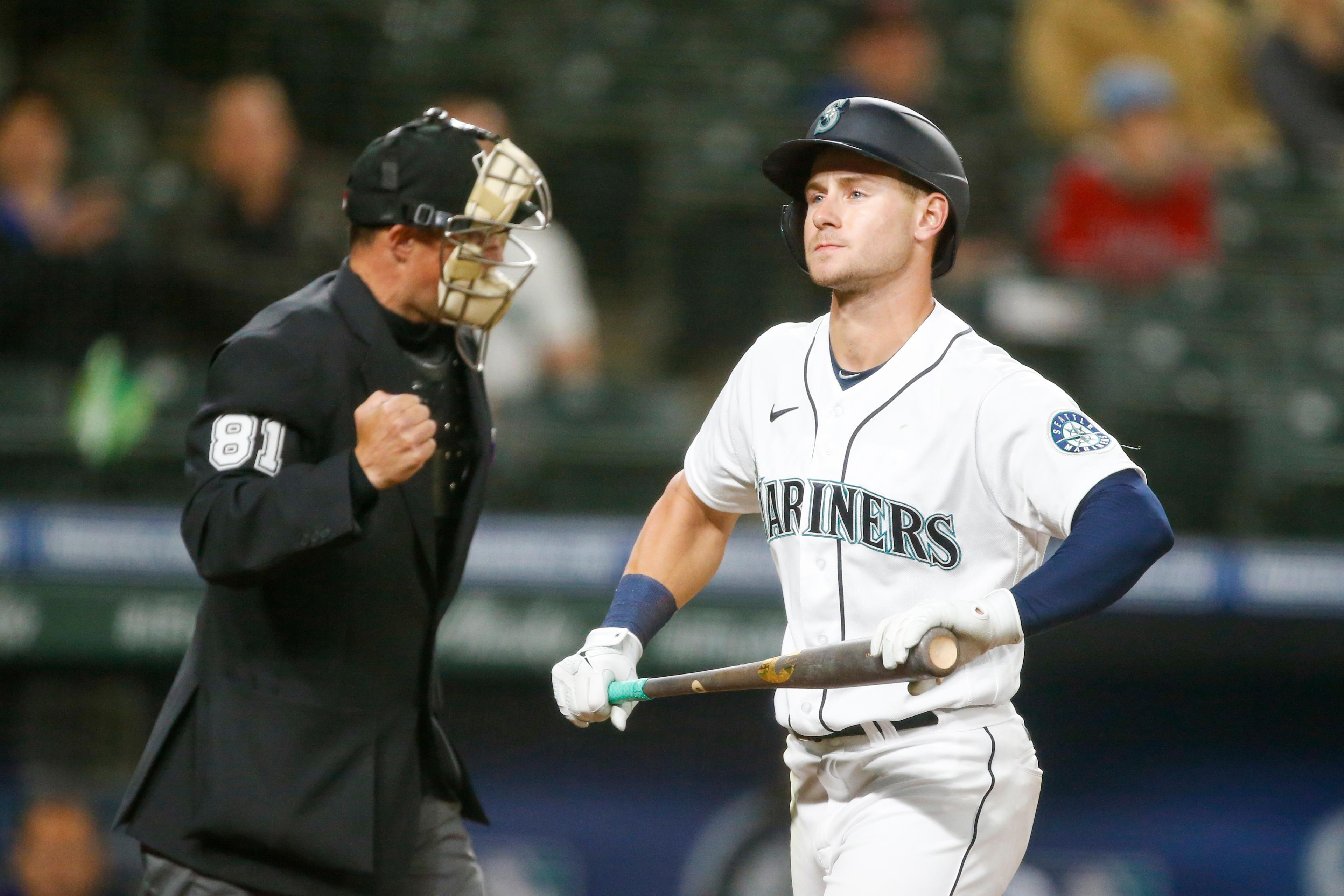 May 27, 2021; Seattle, Washington, USA; Seattle Mariners left fielder Jarred Kelenic (10) returns to the dugout after striking out against the Texas Rangers during the seventh inning at T-Mobile Park. Mandatory Credit: Joe Nicholson-USA TODAY Sports / Joe Nicholson-USA TODAY Sports