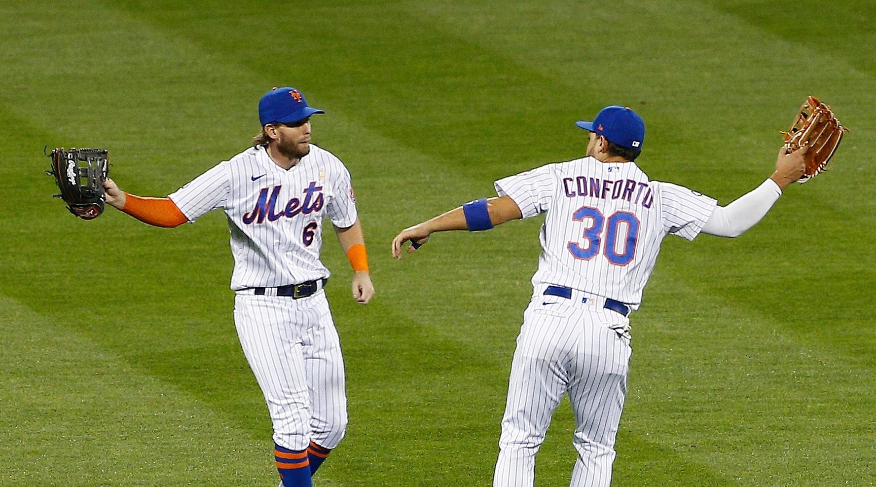 Jeff McNeil and Michael Conforto celebrate after a win / USA TODAY