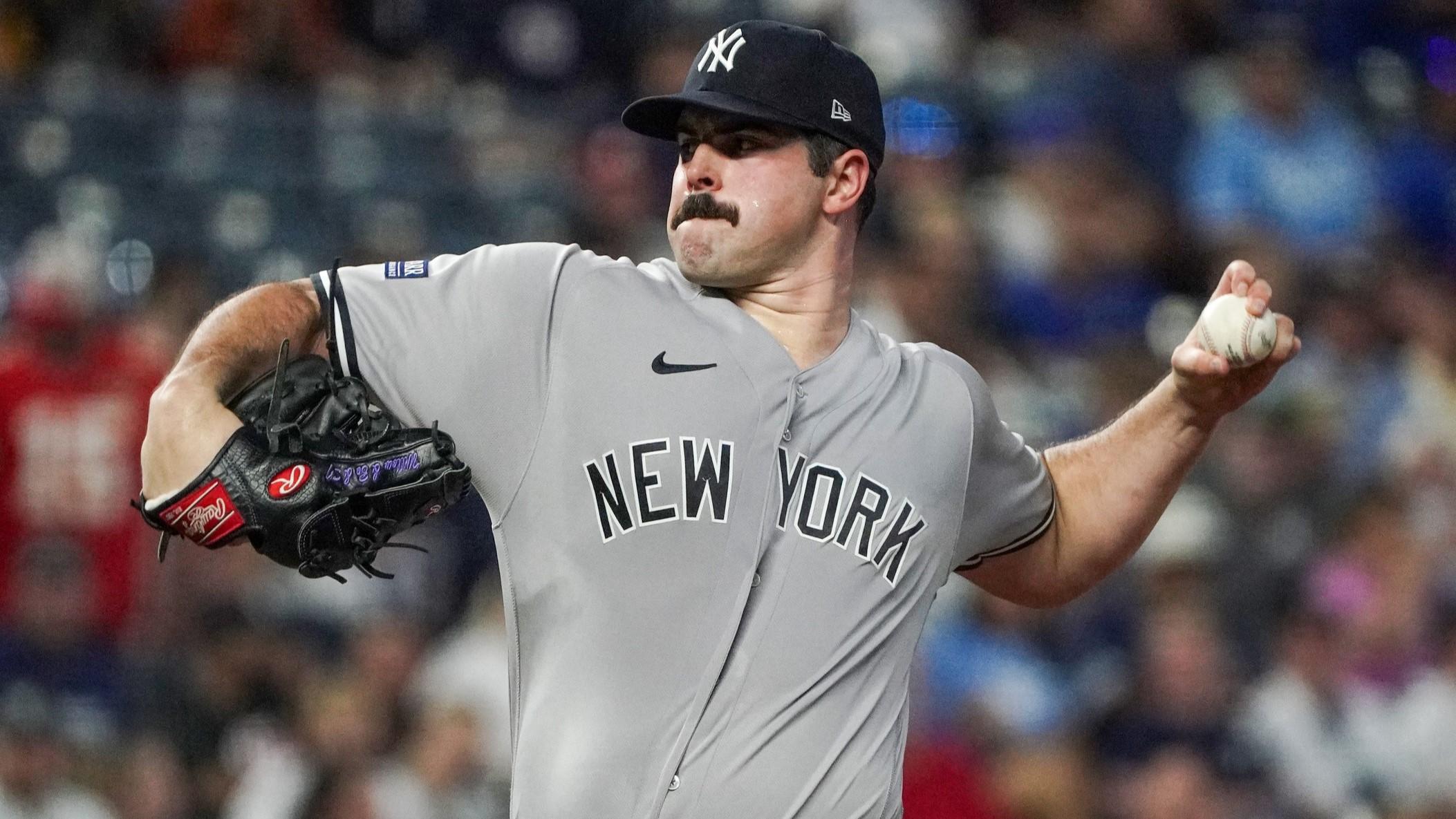 Sep 29, 2023; Kansas City, Missouri, USA; New York Yankees starting pitcher Carlos Rodon (55) delivers a pitch against the Kansas City Royals in the first inning at Kauffman Stadium. / Denny Medley-USA TODAY Sports