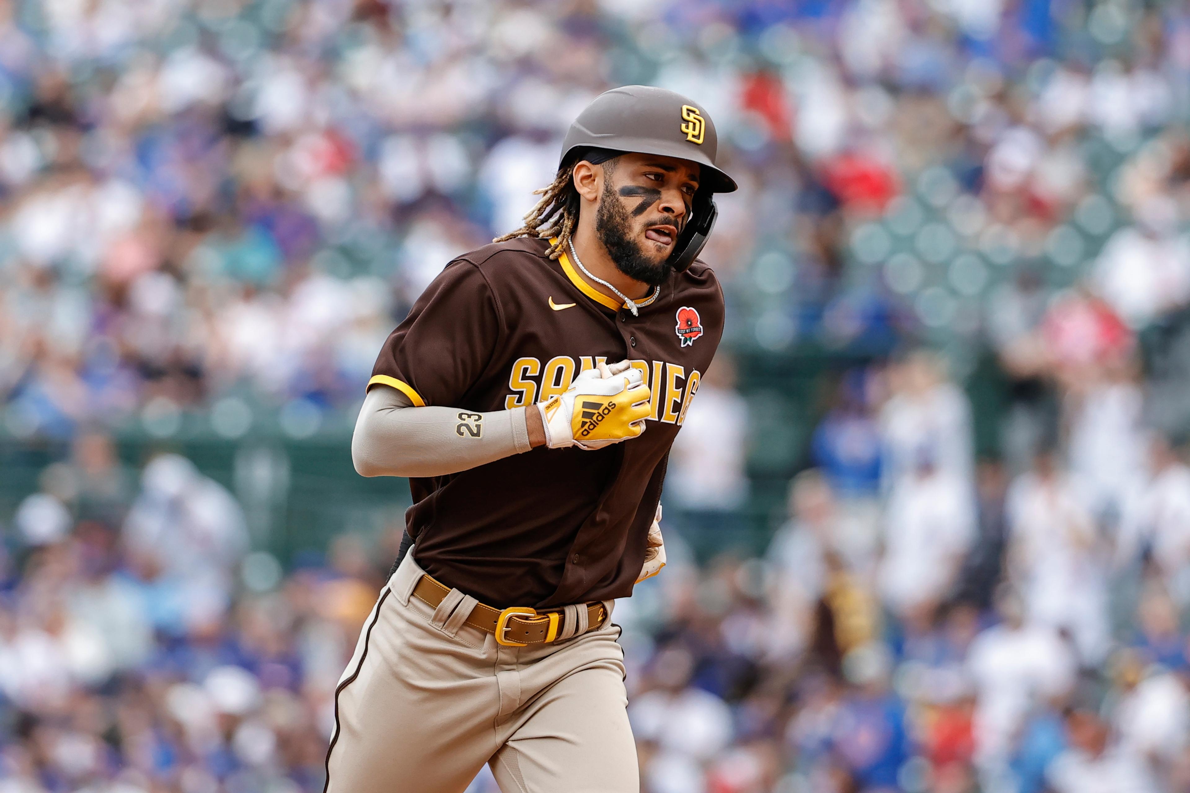 May 31, 2021; Chicago, Illinois, USA; San Diego Padres shortstop Fernando Tatis Jr. (23) rounds the bases after hitting a solo home run against the Chicago Cubs during the sixth inning at Wrigley Field. / Kamil Krzaczynski-USA TODAY Sports