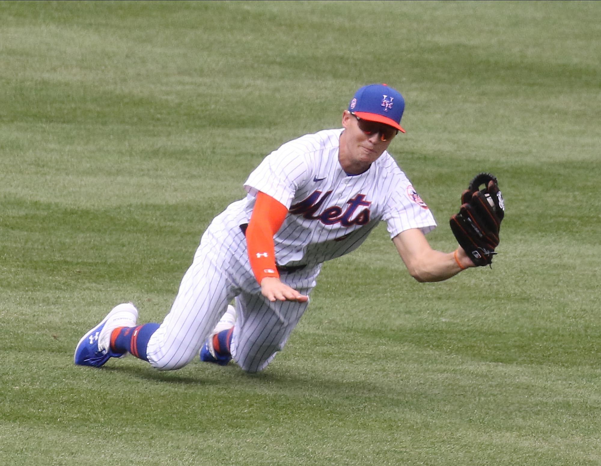 Brandon Nimmo makes this diving catch in centerfield during the Mets inter squad game at Citi Field on July 15, 2020 in preparation for the weekends exhibition games against the New York Yankees. The New York Mets Workout At Citi Field On July 15 2020 In Preparation For The Weekends Exhibition Games Against The New York Yankees / Chris Pedota, NorthJersey.com via Imagn Content Services, LLC