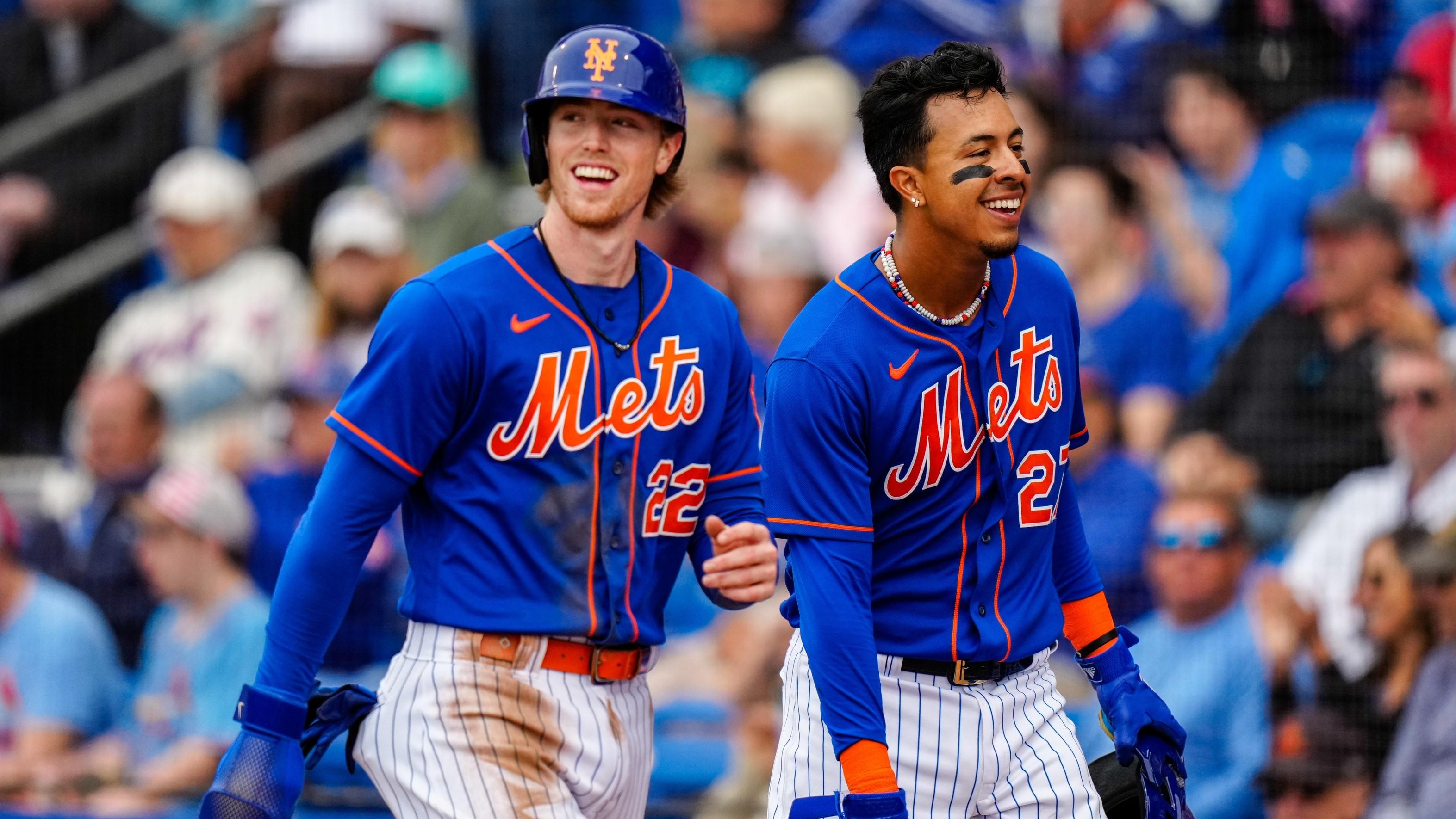 Mar 19, 2023; Port St. Lucie, Florida, USA; New York Mets third baseman Brett Baty (22) and New York Mets first baseman Mark Vientos (27) walk back to the dugout after running home against the St. Louis Cardinals during the first inning at Clover Park. / Rich Storry-USA TODAY Sports
