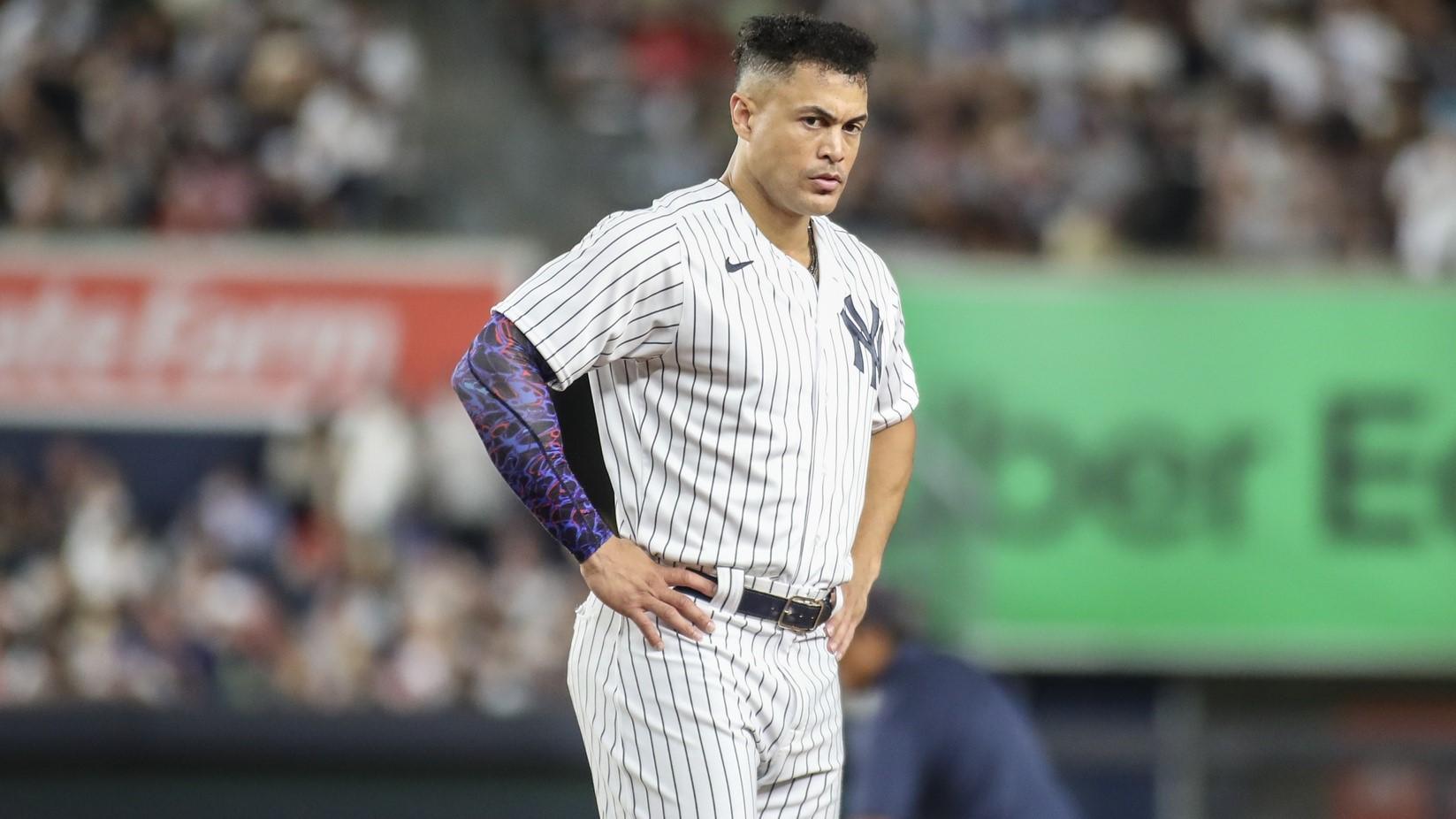Aug 18, 2023; Bronx, New York, USA; New York Yankees right fielder Giancarlo Stanton (27) stays on the field after an inning ending double play in the sixth inning against the Boston Red Sox at Yankee Stadium. / Wendell Cruz-USA TODAY Sports