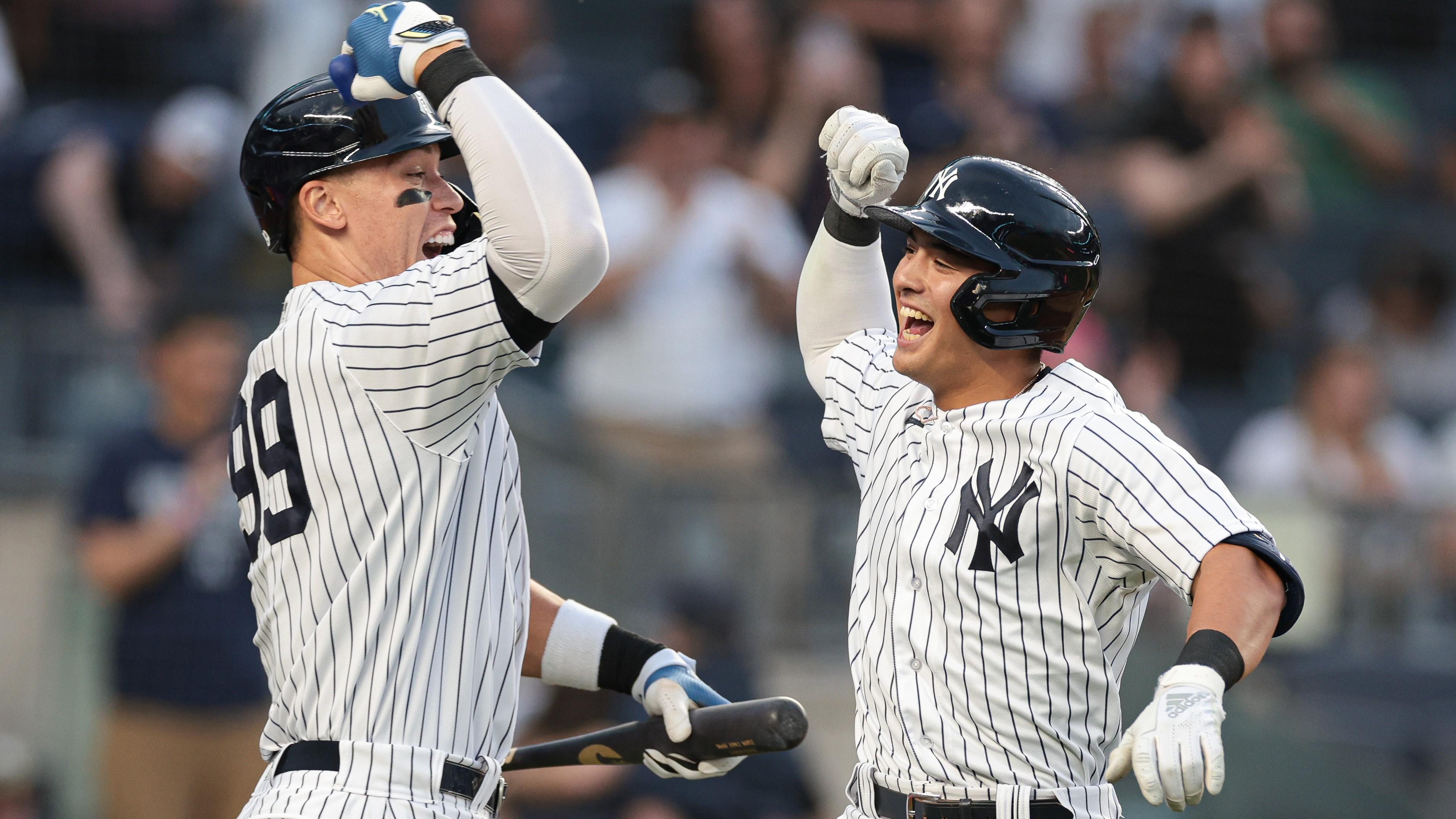 Apr 14, 2023; Bronx, New York, USA; New York Yankees shortstop Anthony Volpe (11) celebrates his solo home run with right fielder Aaron Judge (99) during the first inning against the Minnesota Twins at Yankee Stadium. Mandatory Credit: Vincent Carchietta-USA TODAY Sports / © Vincent Carchietta-USA TODAY Sports